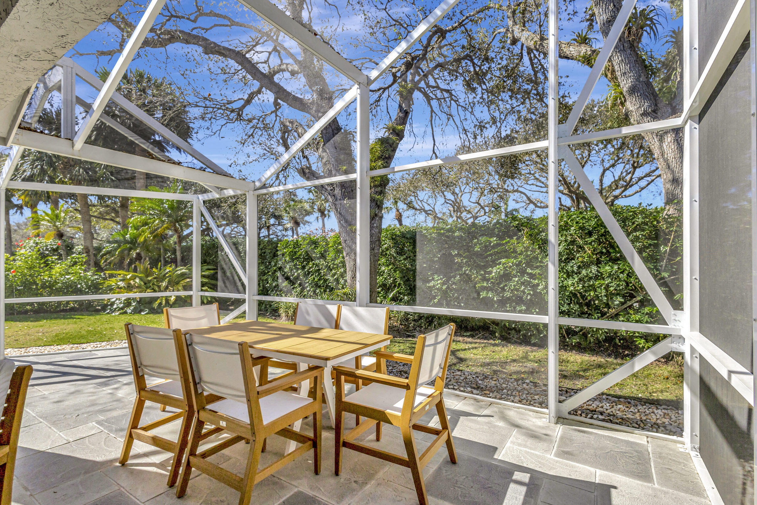 16501 Riverwind Drive Jupiter, FL 33477 - Photo 48 of 50 a view of a swimming pool with a patio