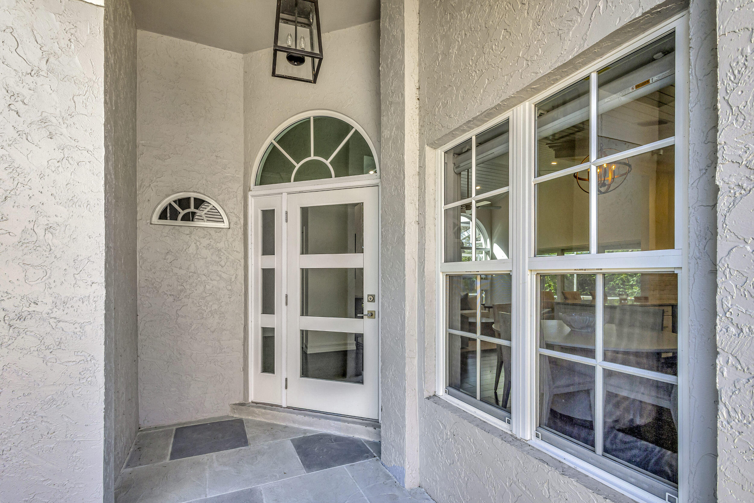 16501 Riverwind Drive Jupiter, FL 33477 - Photo 5 of 50 a view of front door of house