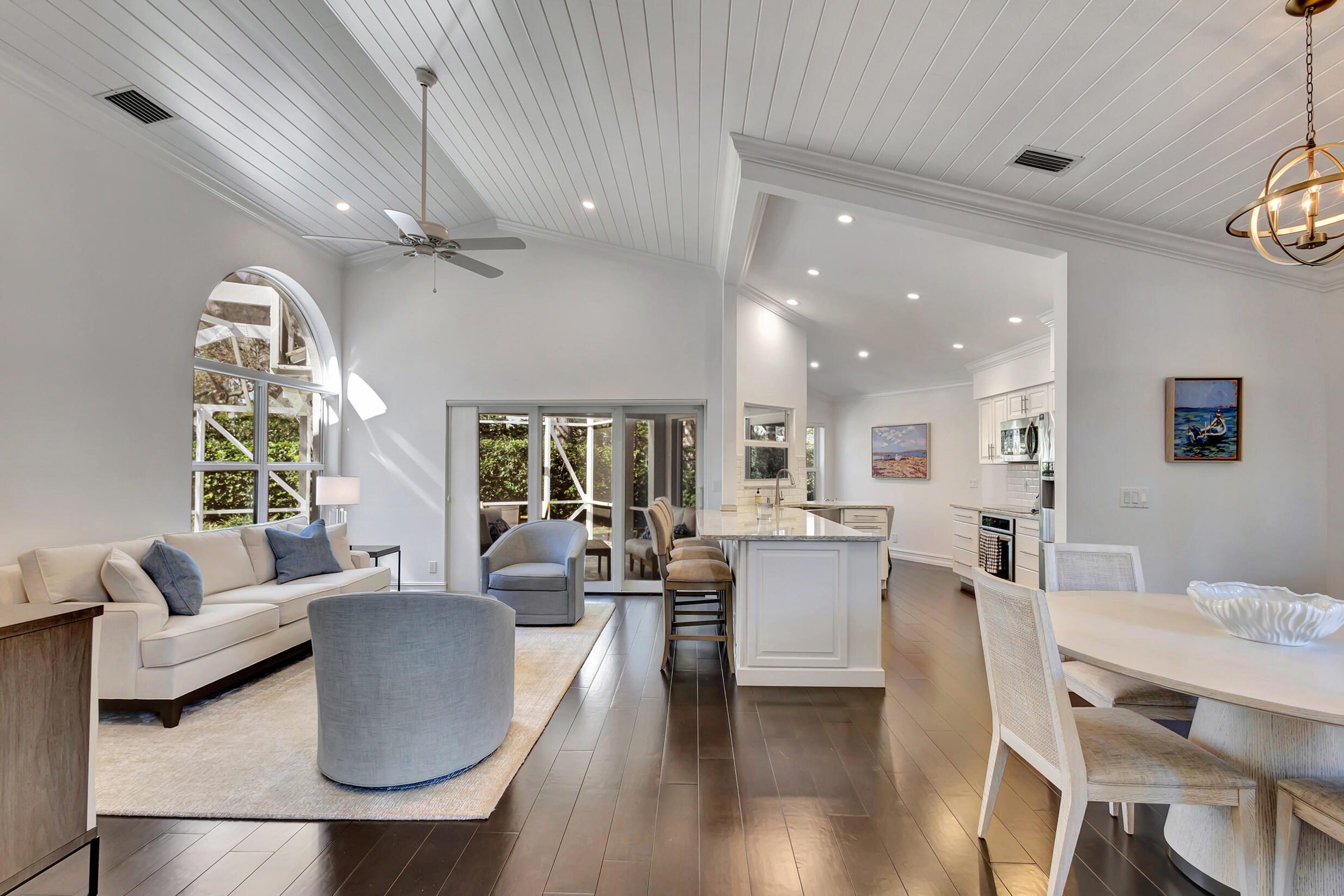 16501 Riverwind Drive Jupiter, FL 33477 - Photo 7 of 50 a living room with furniture and a large window