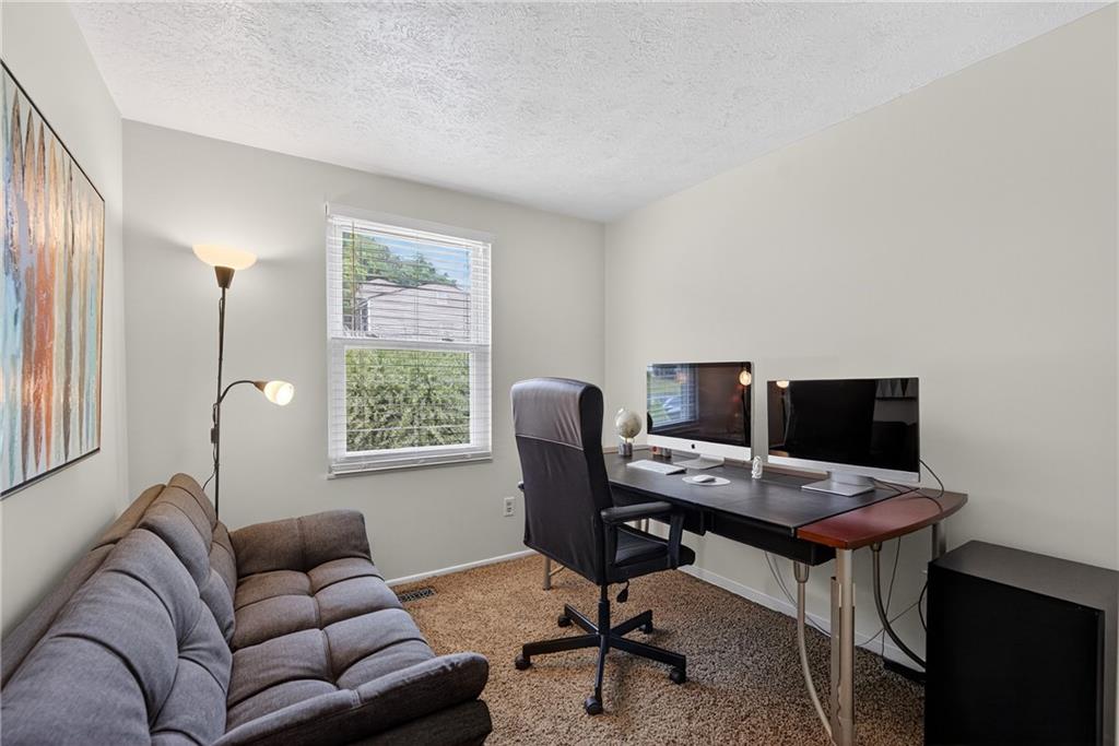 1304 Greenhill Rd Extension Pittsburgh, PA 15209 - Photo 15 of 31 a work room with furniture and a window
