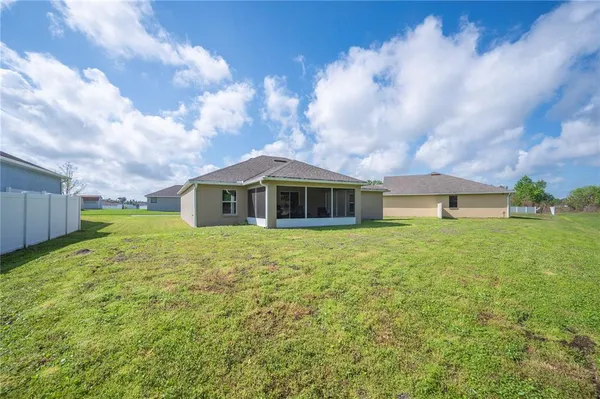 a view of a house with a big yard