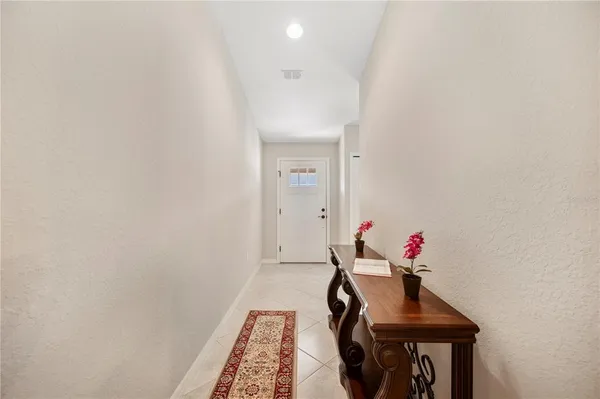 a kitchen with stainless steel appliances kitchen island granite countertop a refrigerator and a stove top oven