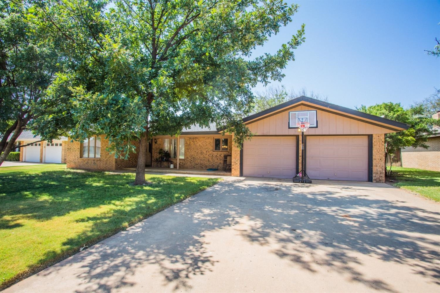 2118 Tech Drive Levelland, TX 79336 - Photo 1 of 42 a front view of a house with a yard and garage