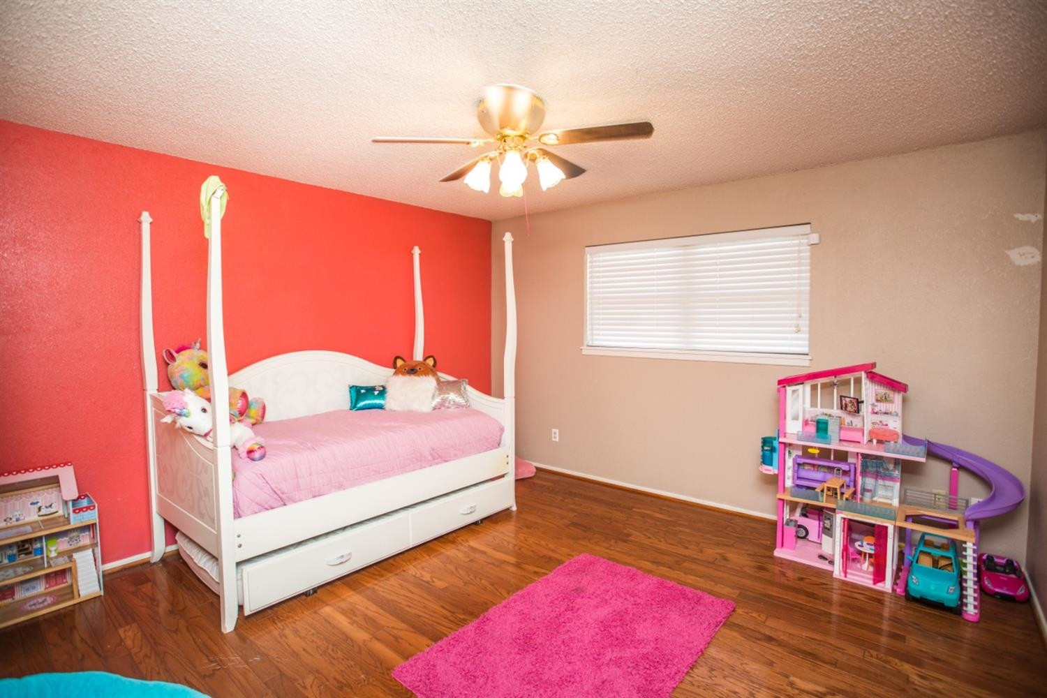 2118 Tech Drive Levelland, TX 79336 - Photo 15 of 42 a bedroom with a bed and a chandelier