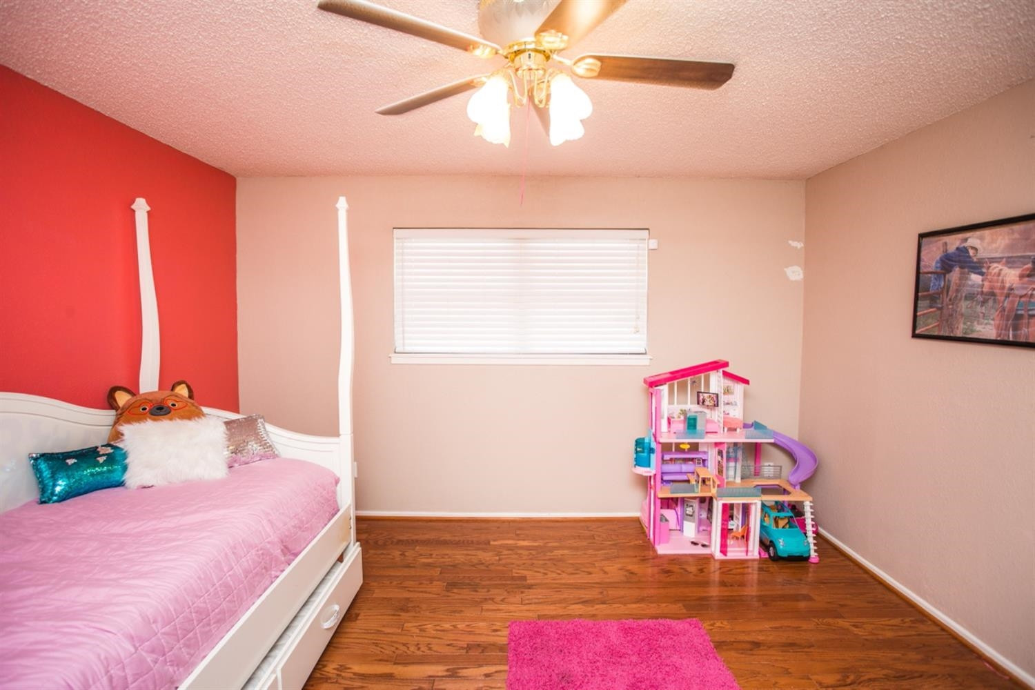 2118 Tech Drive Levelland, TX 79336 - Photo 17 of 42 a bedroom with a bed and a chandelier