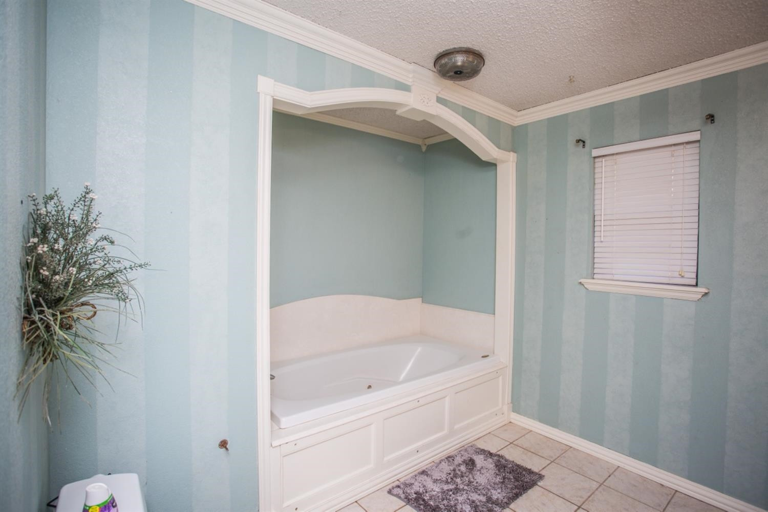 2118 Tech Drive Levelland, TX 79336 - Photo 21 of 42 a bathroom with a tub and shower