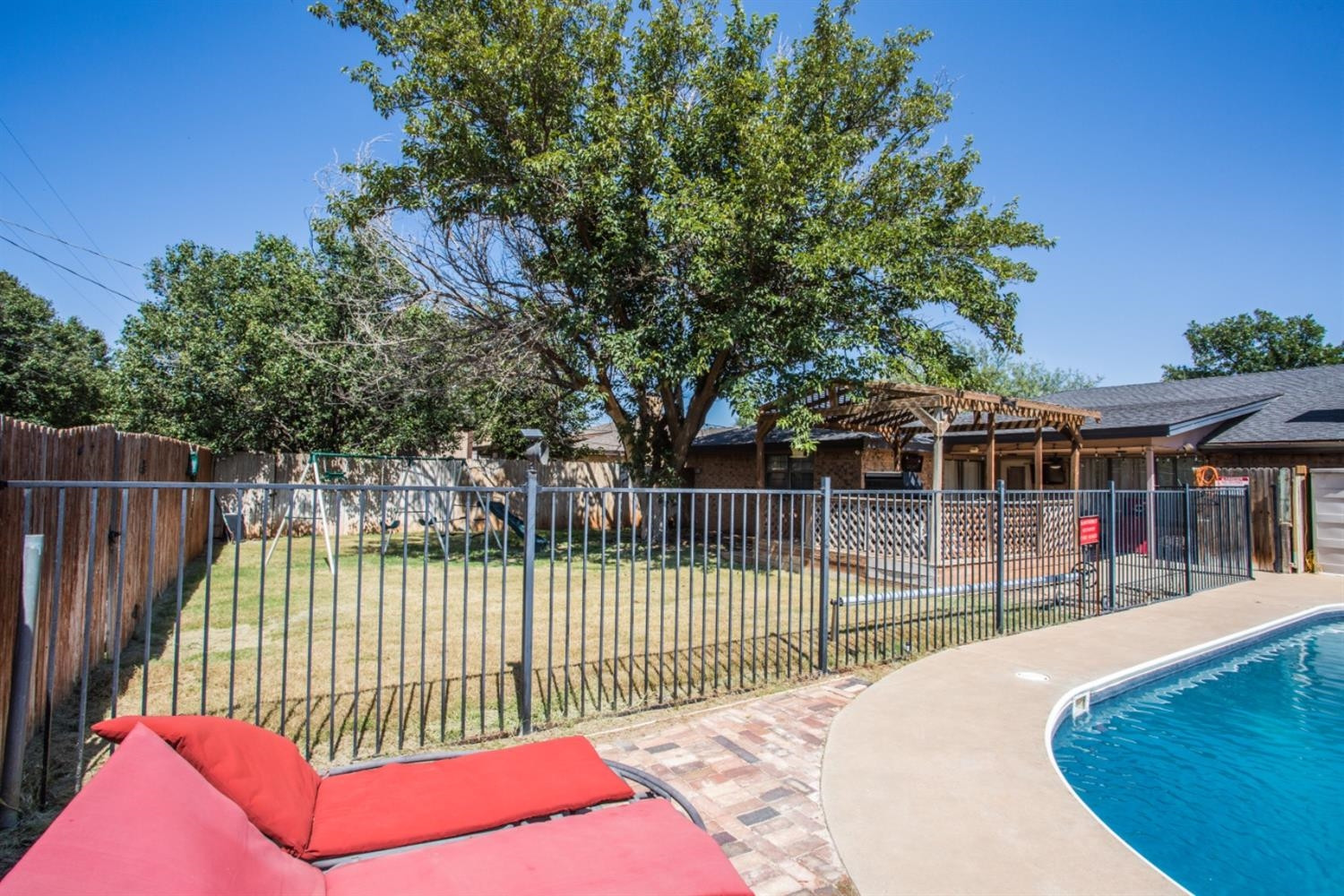 2118 Tech Drive Levelland, TX 79336 - Photo 30 of 42 a view of a wrought iron fences in front of house