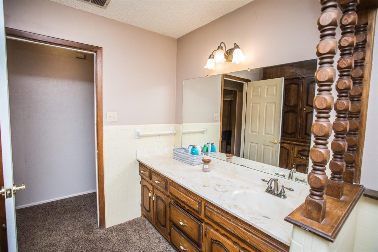 2118 Tech Drive Levelland, TX 79336 - Photo 36 of 42 a bathroom with a sink vanity and a mirror
