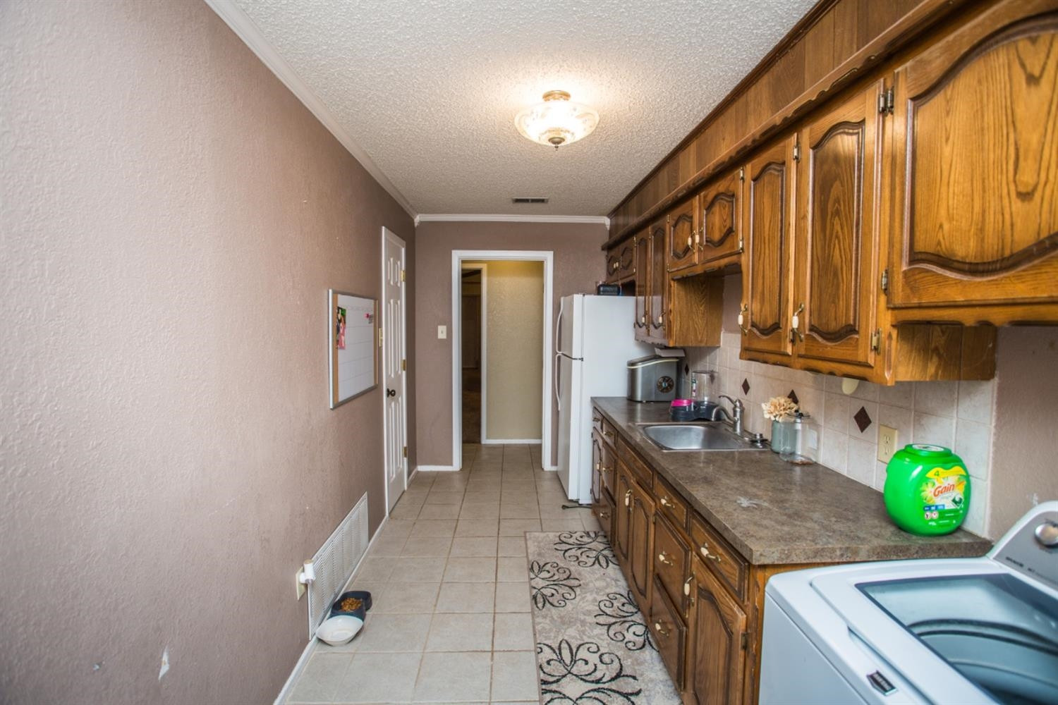 2118 Tech Drive Levelland, TX 79336 - Photo 37 of 42 a kitchen with stove and cabinets