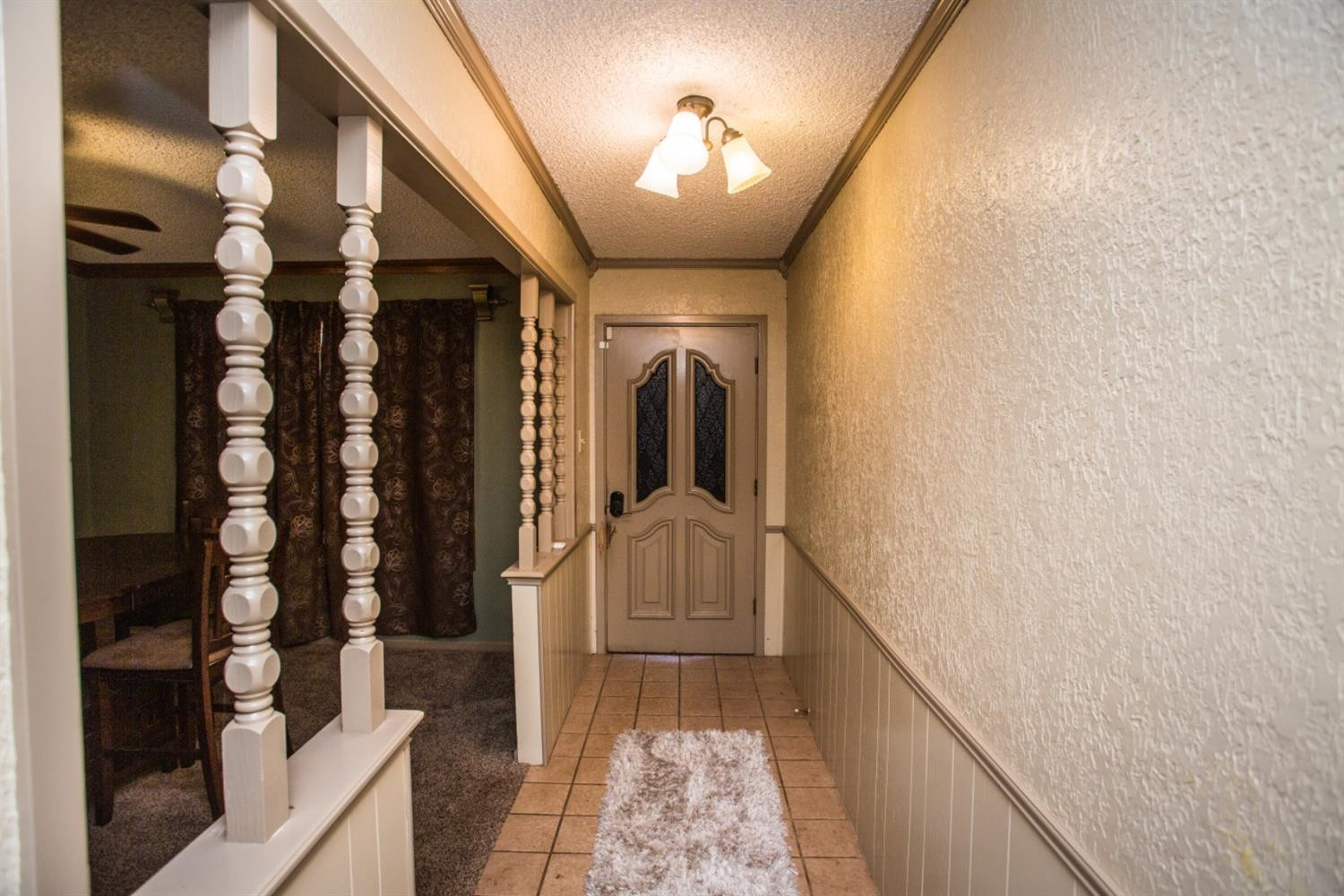 2118 Tech Drive Levelland, TX 79336 - Photo 40 of 42 a view of hallway with stairs and wooden floor