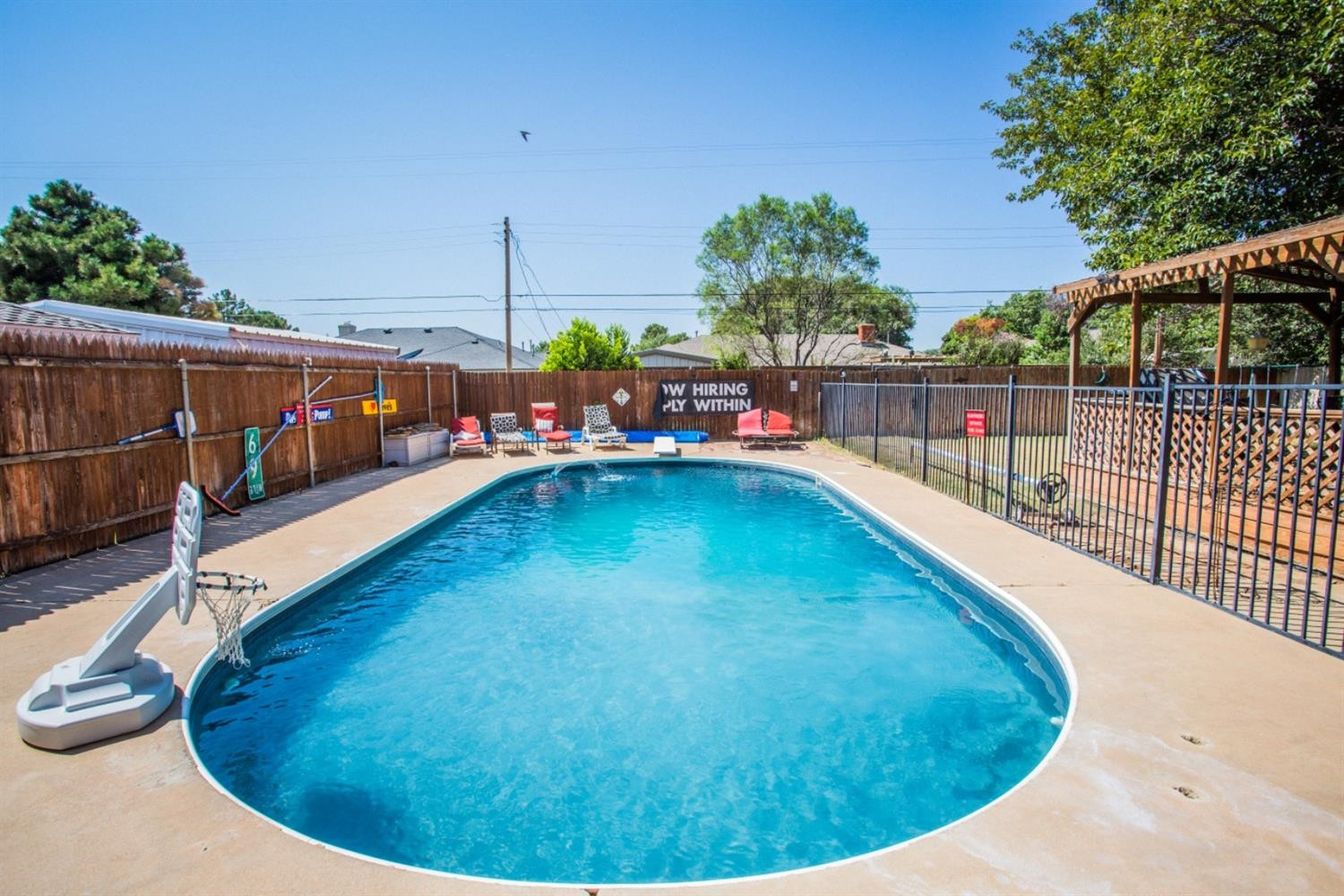 2118 Tech Drive Levelland, TX 79336 - Photo 5 of 42 a view of a swimming pool with an outdoor seating