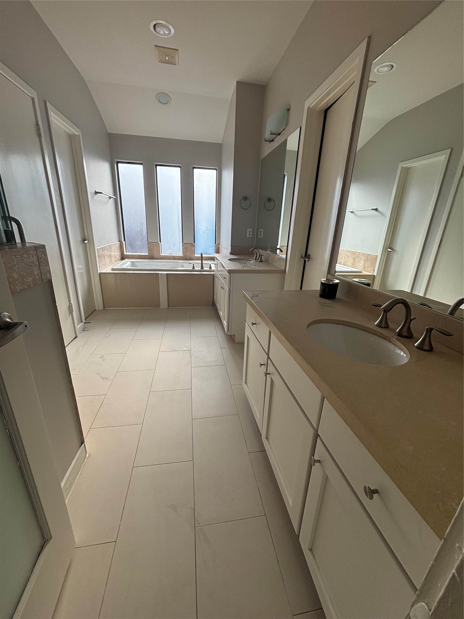 6016 Truro Street Houston, TX 77007 - Photo 16 of 26 Spa-inspired primary bath featuring dual vanities, a soaking tub, separate shower, and abundant natural light