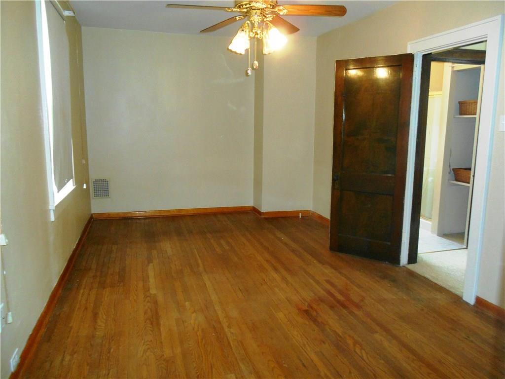 1165 Race Street McKees Rocks, PA 15136 - Photo 11 of 25 The master bedroom has two large windows and hardwood floors.