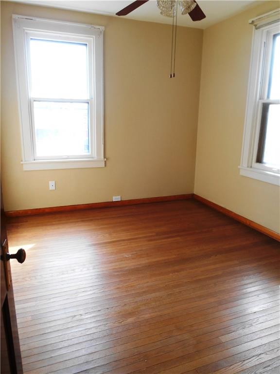1165 Race Street McKees Rocks, PA 15136 - Photo 14 of 25 Additional room #2 has hardwood floors and a ceiling fan. I could also be another bedroom with an added wardrobe or even a GREAT office space!