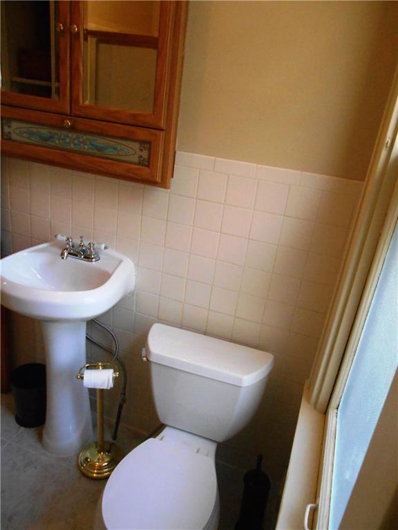 1165 Race Street McKees Rocks, PA 15136 - Photo 16 of 25 Newer sink, toilet and vanity.