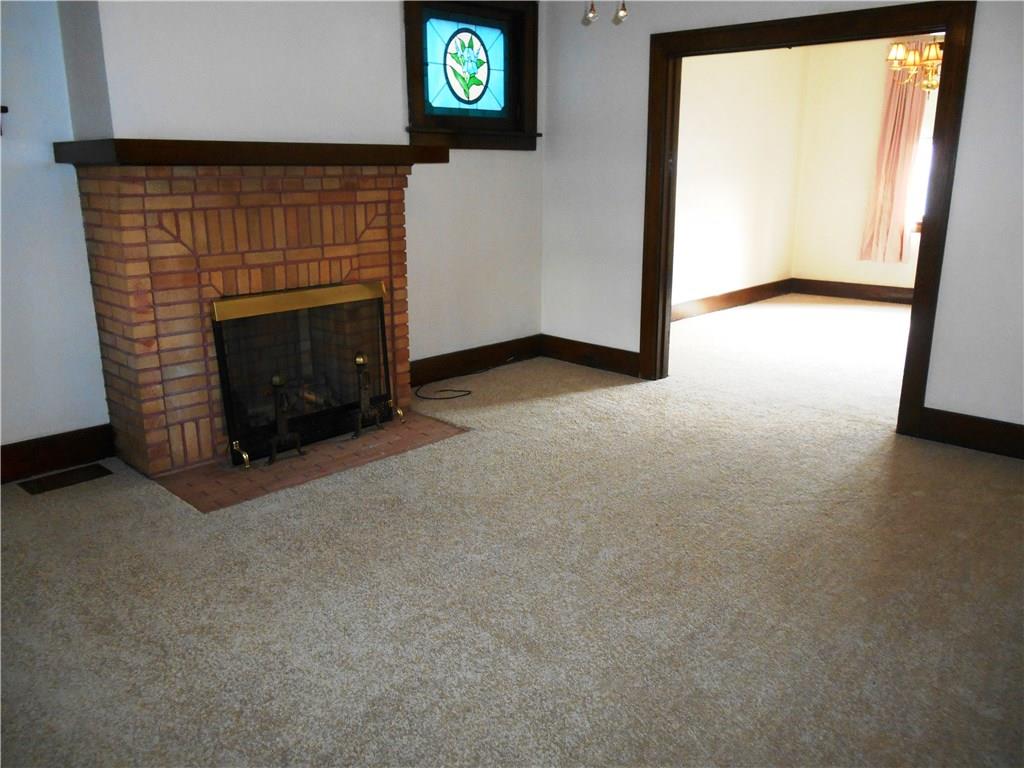 The living room open into the large dining room.  All NEW carpet and fresh neutral paint!
