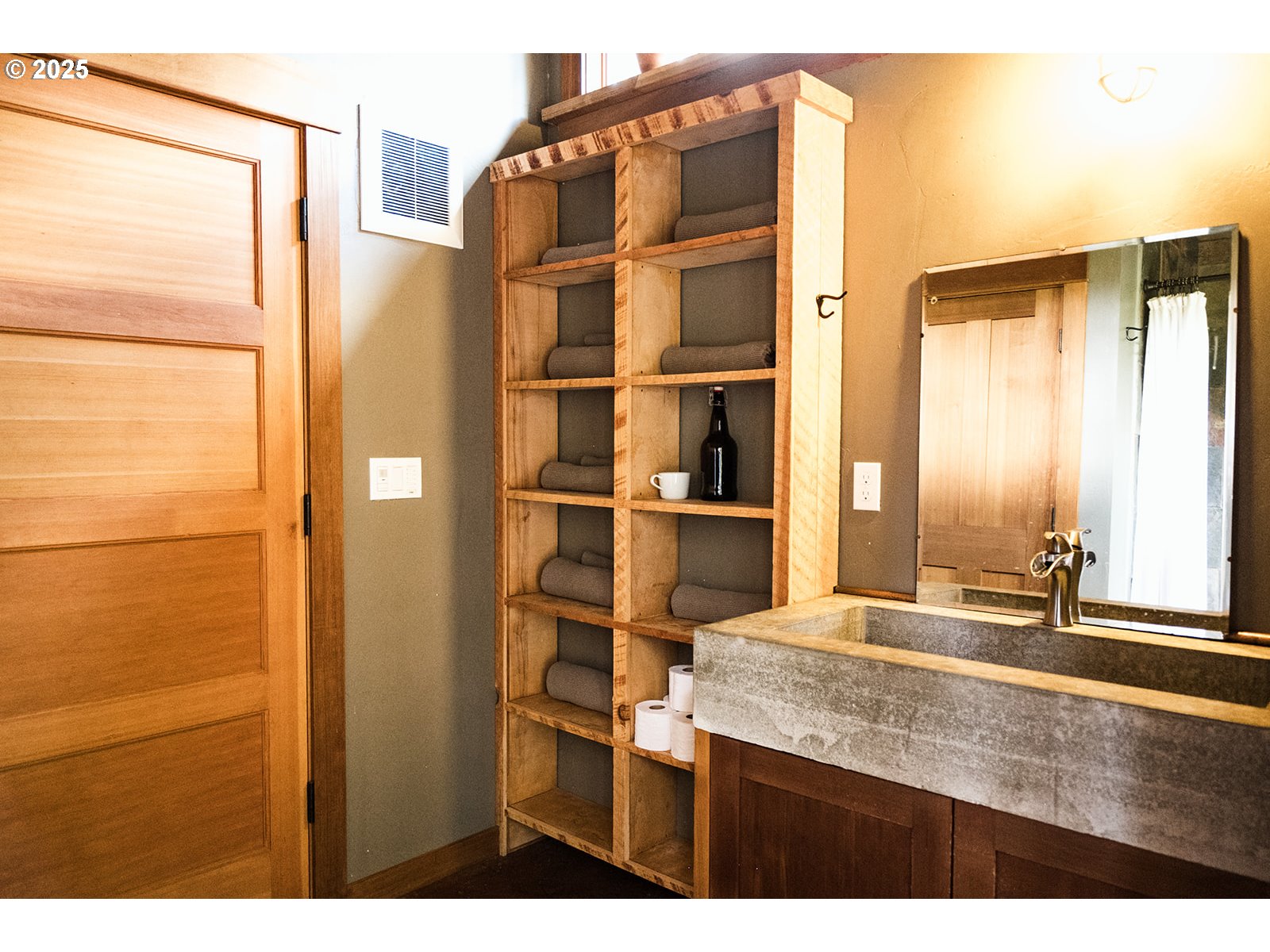 230 Jennings Road Trout Lake, WA 98650 - Photo 28 of 47 a view of a bathroom with a sink and a large mirror