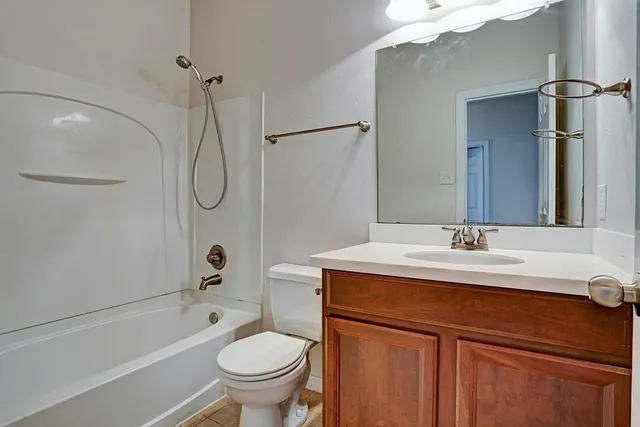 a bathroom with a sink a toilet and a bathtub