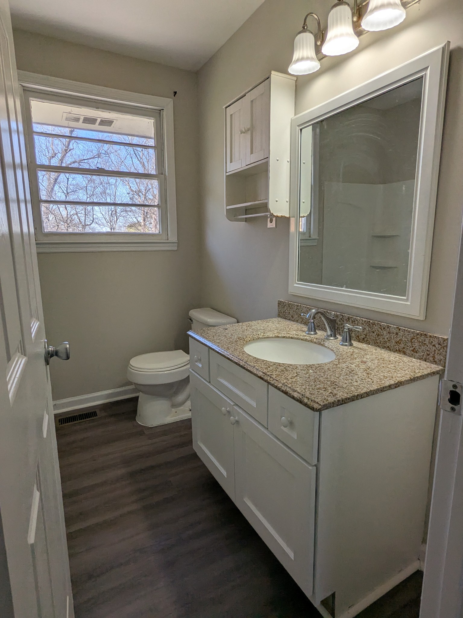4721 McBride Road Antioch, TN 37013 - Photo 12 of 12 a bathroom with a granite countertop sink toilet and mirror