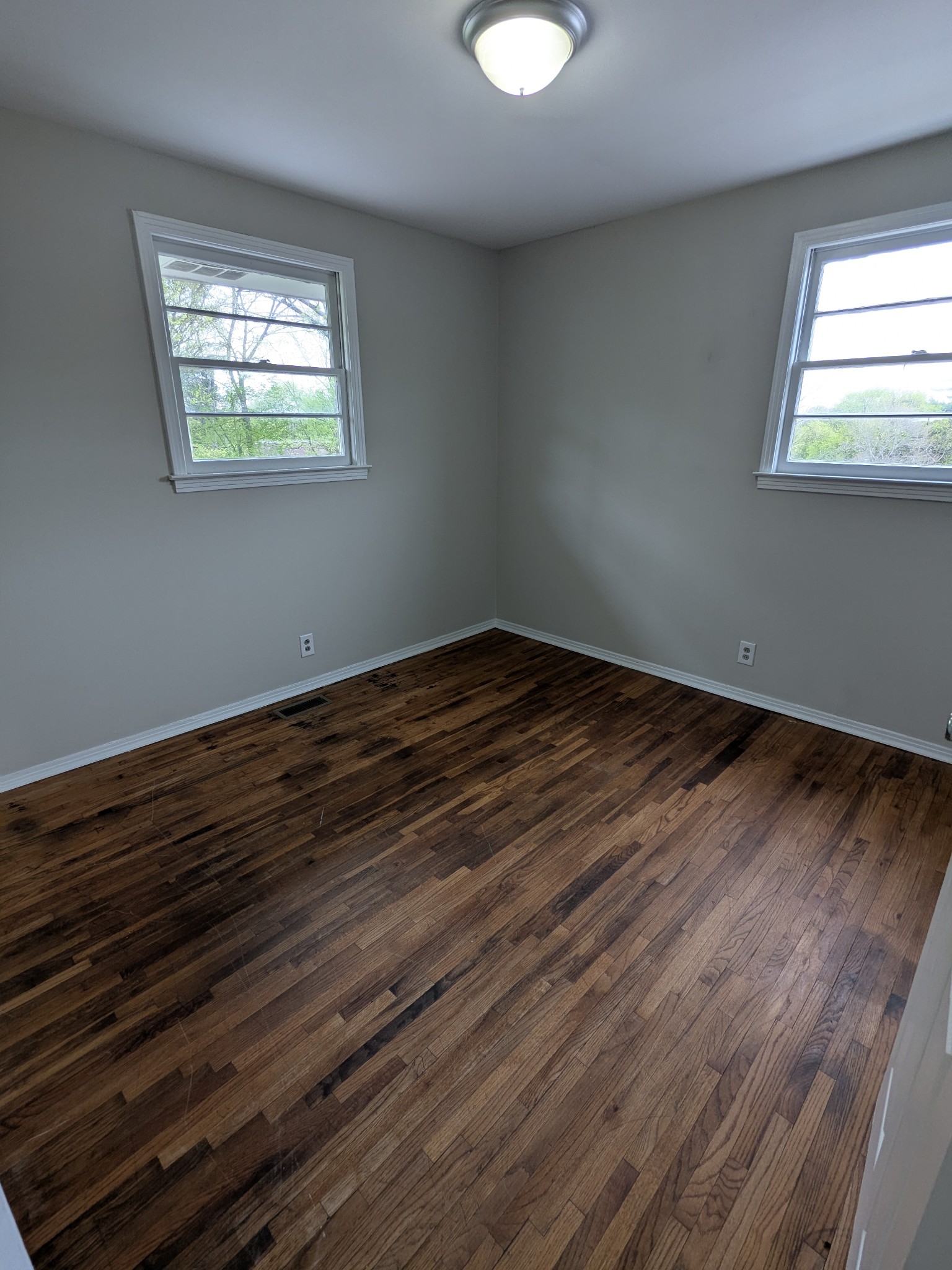4721 McBride Road Antioch, TN 37013 - Photo 10 of 12 a view of an empty room with wooden floor and a window