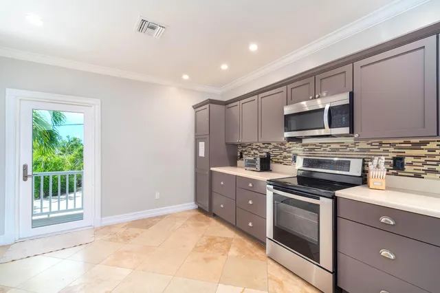 a kitchen with a table and chairs in it