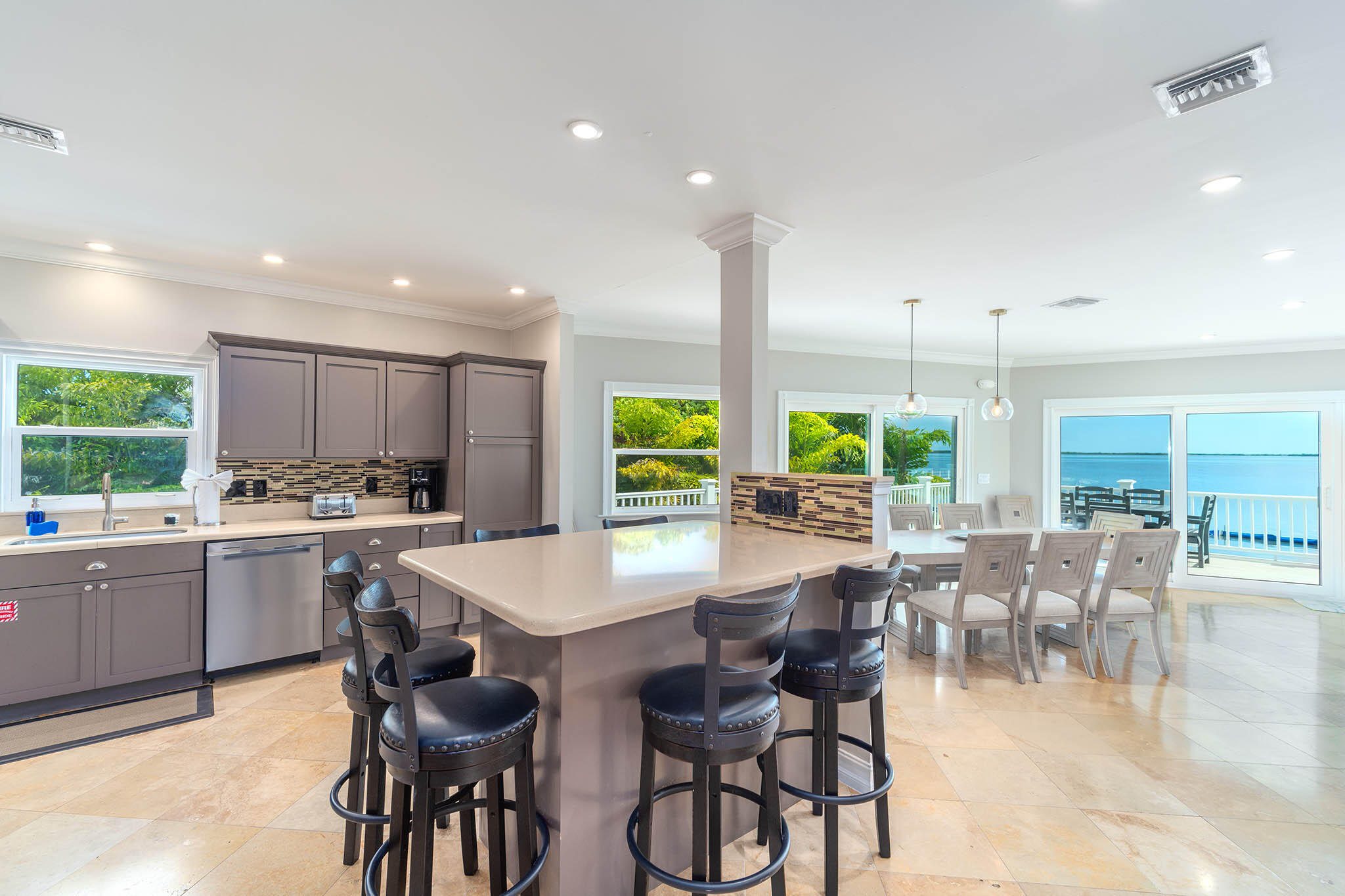31473 Warner Street Big Pine Key, FL 33043 - Photo 14 of 49 a kitchen with a table and chairs in it