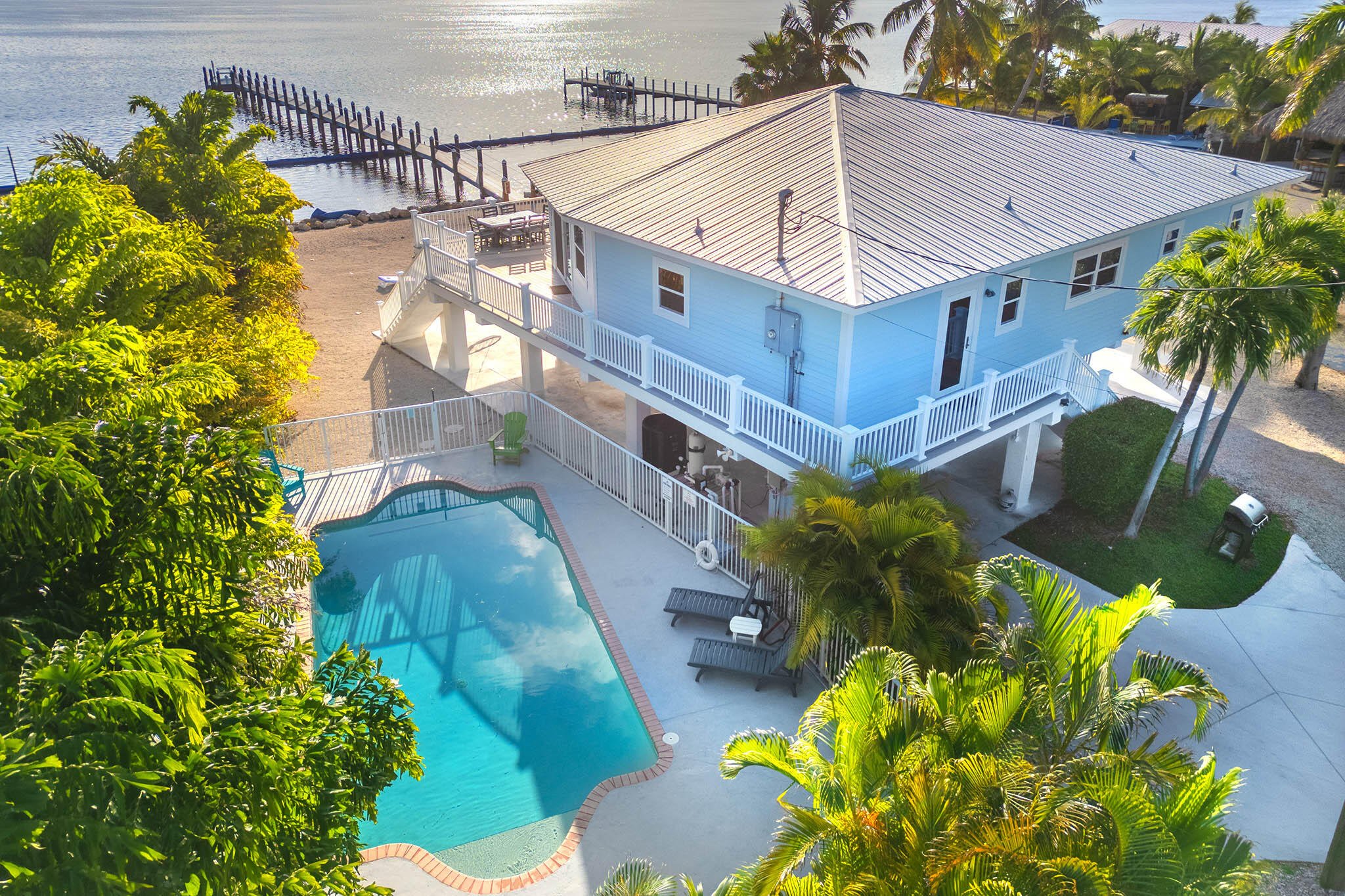 31473 Warner Street Big Pine Key, FL 33043 - Photo 2 of 49 a view of a house with a flower garden