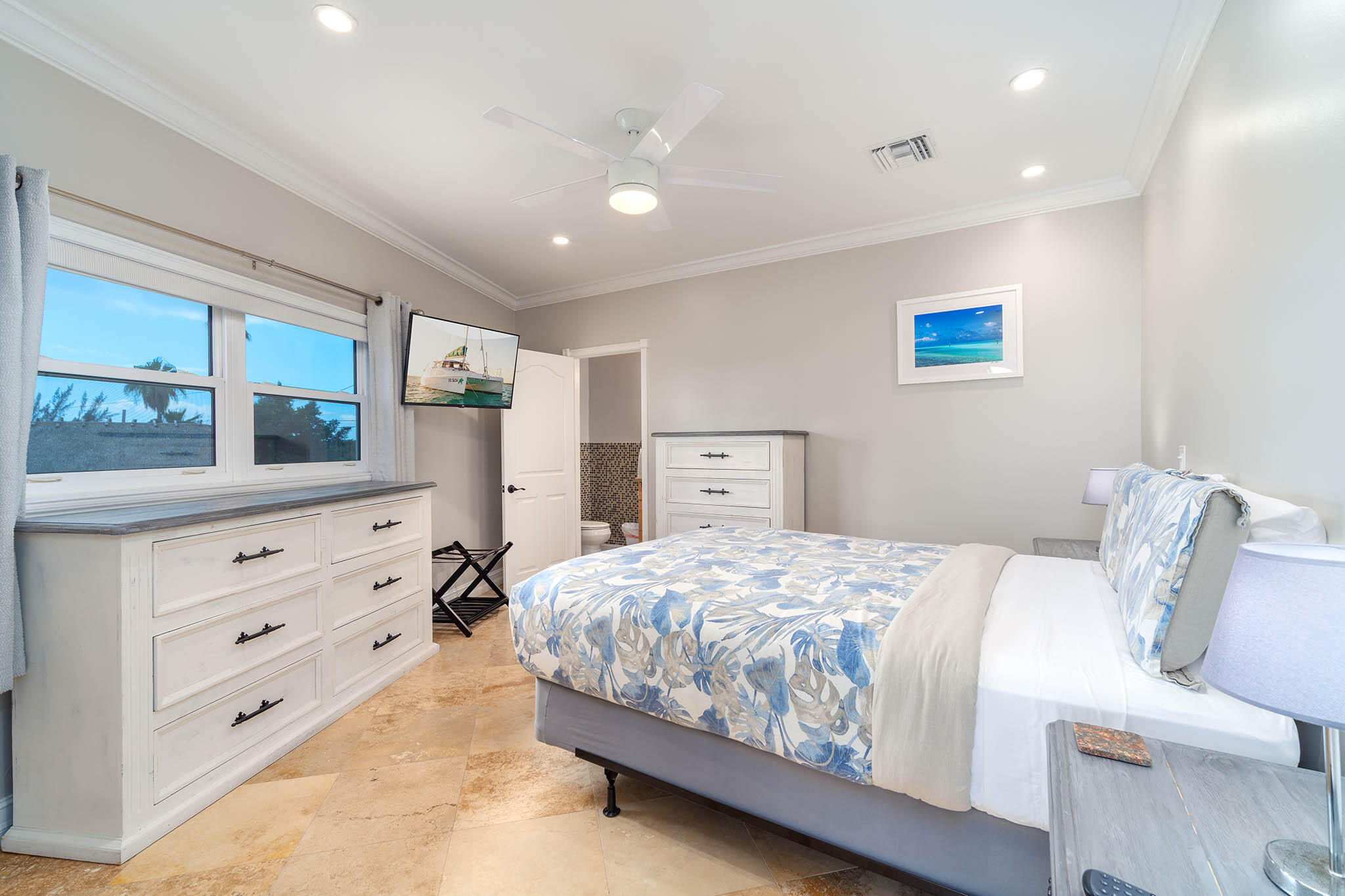 31473 Warner Street Big Pine Key, FL 33043 - Photo 21 of 49 a bedroom with a bed and a dresser