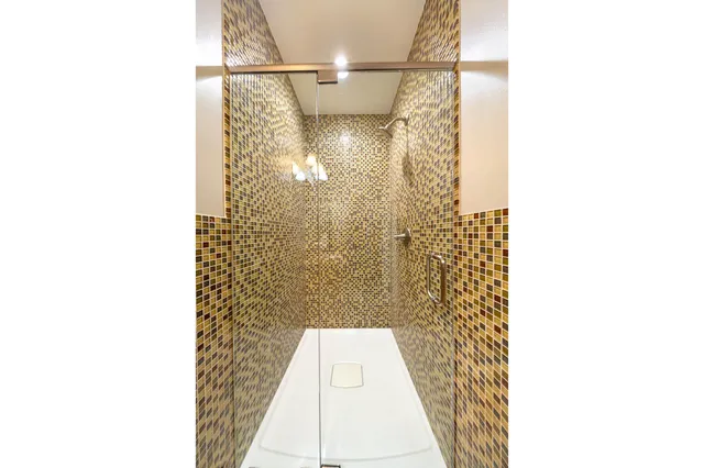 a bedroom with a bed couch and window