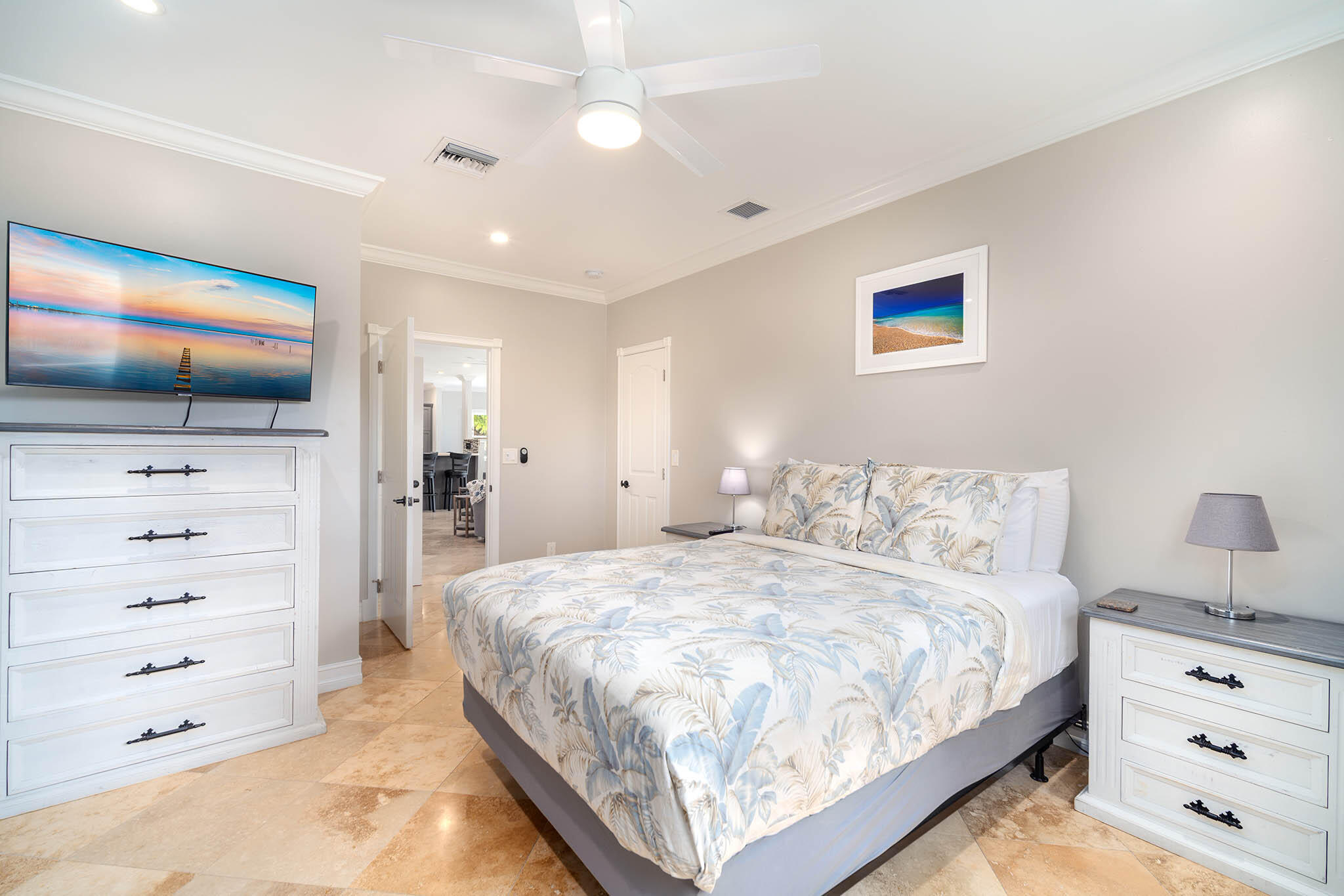 31473 Warner Street Big Pine Key, FL 33043 - Photo 27 of 49 a bedroom with a bed and a flat screen tv