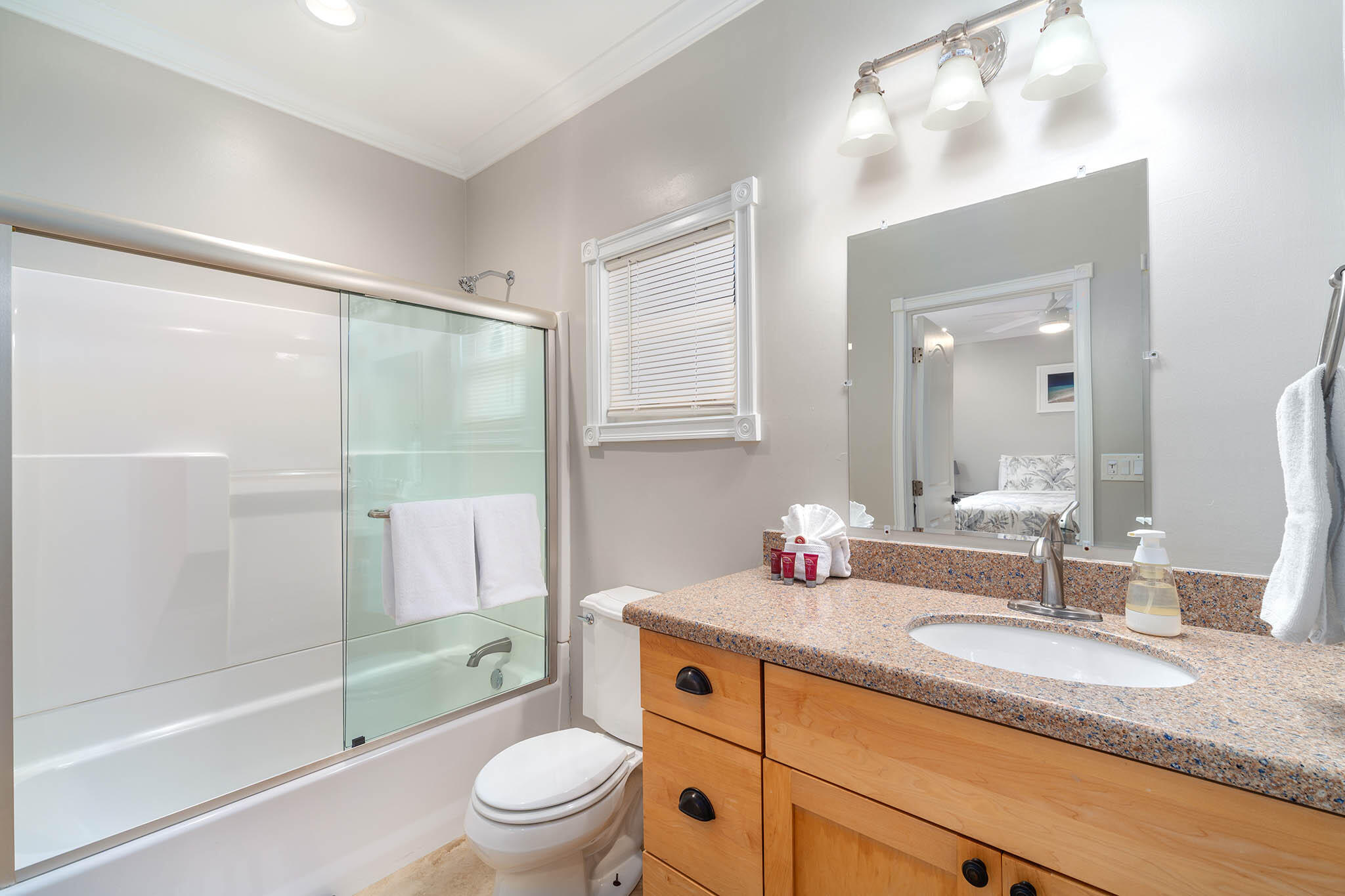 31473 Warner Street Big Pine Key, FL 33043 - Photo 28 of 49 a bathroom with a granite countertop sink toilet and shower