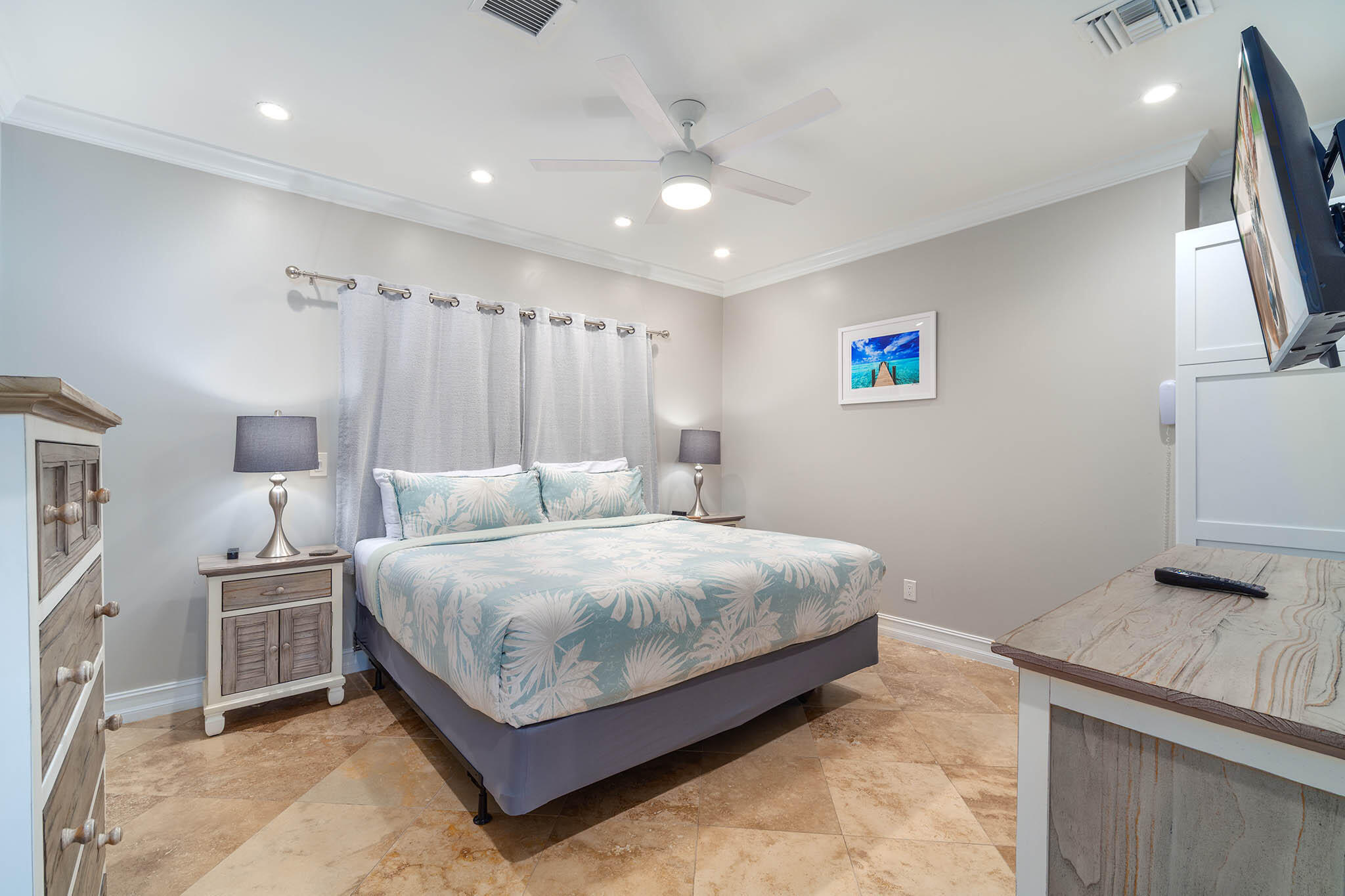 31473 Warner Street Big Pine Key, FL 33043 - Photo 29 of 49 a spacious bedroom with a bed and a flat screen tv