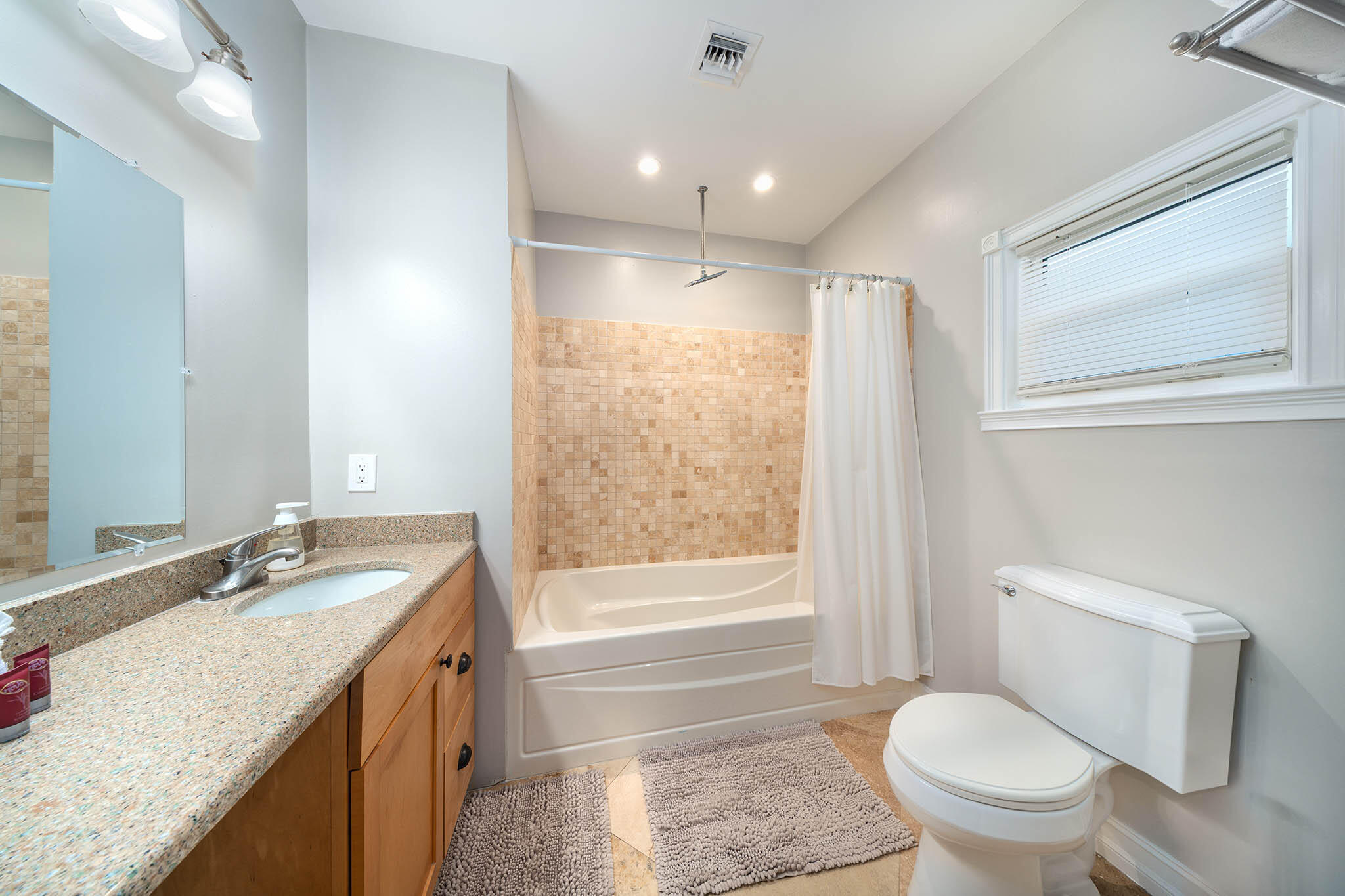 31473 Warner Street Big Pine Key, FL 33043 - Photo 31 of 49 a bathroom with a granite countertop sink toilet and shower