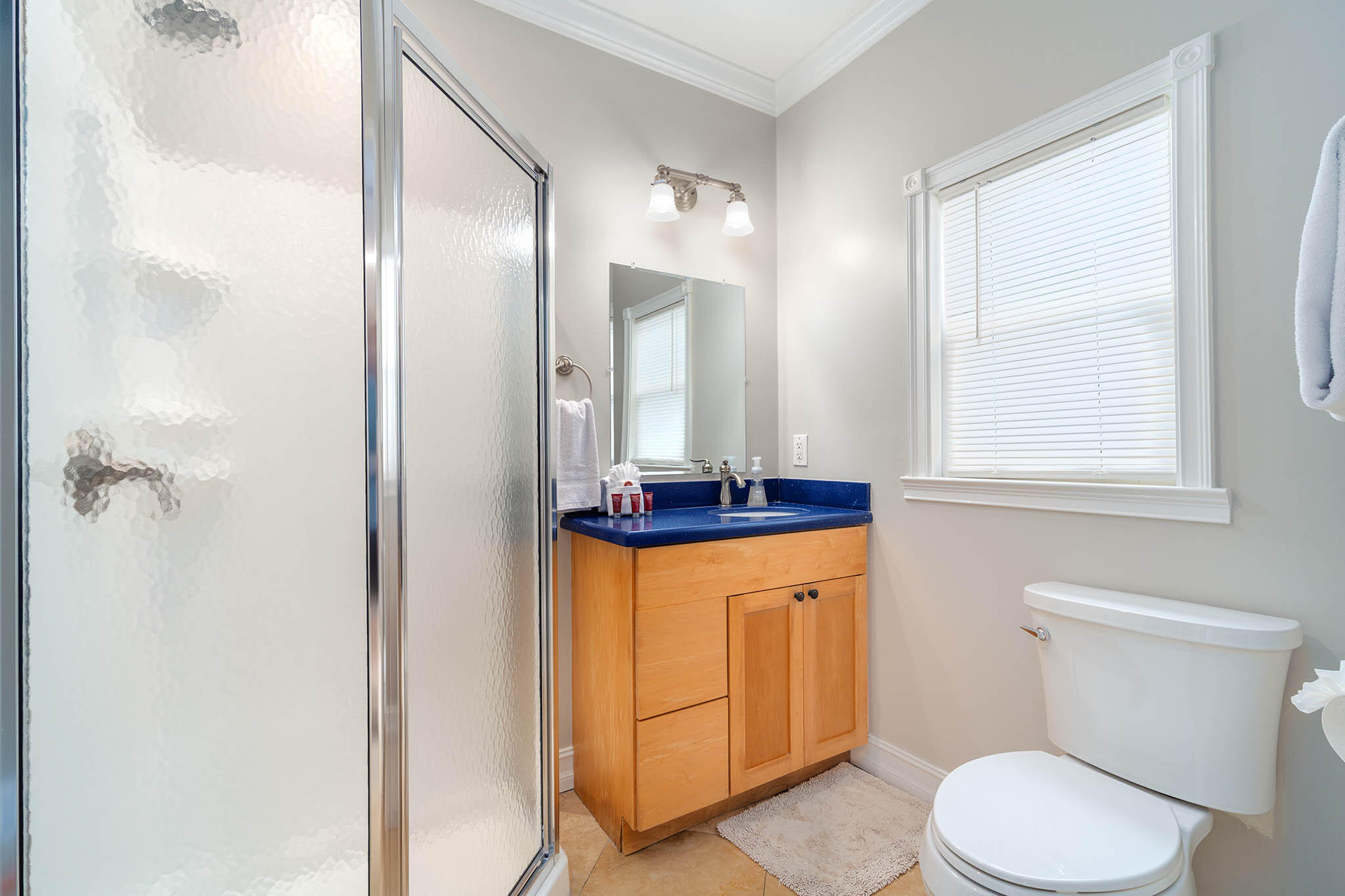 31473 Warner Street Big Pine Key, FL 33043 - Photo 32 of 49 a bathroom with a toilet a sink and a mirror