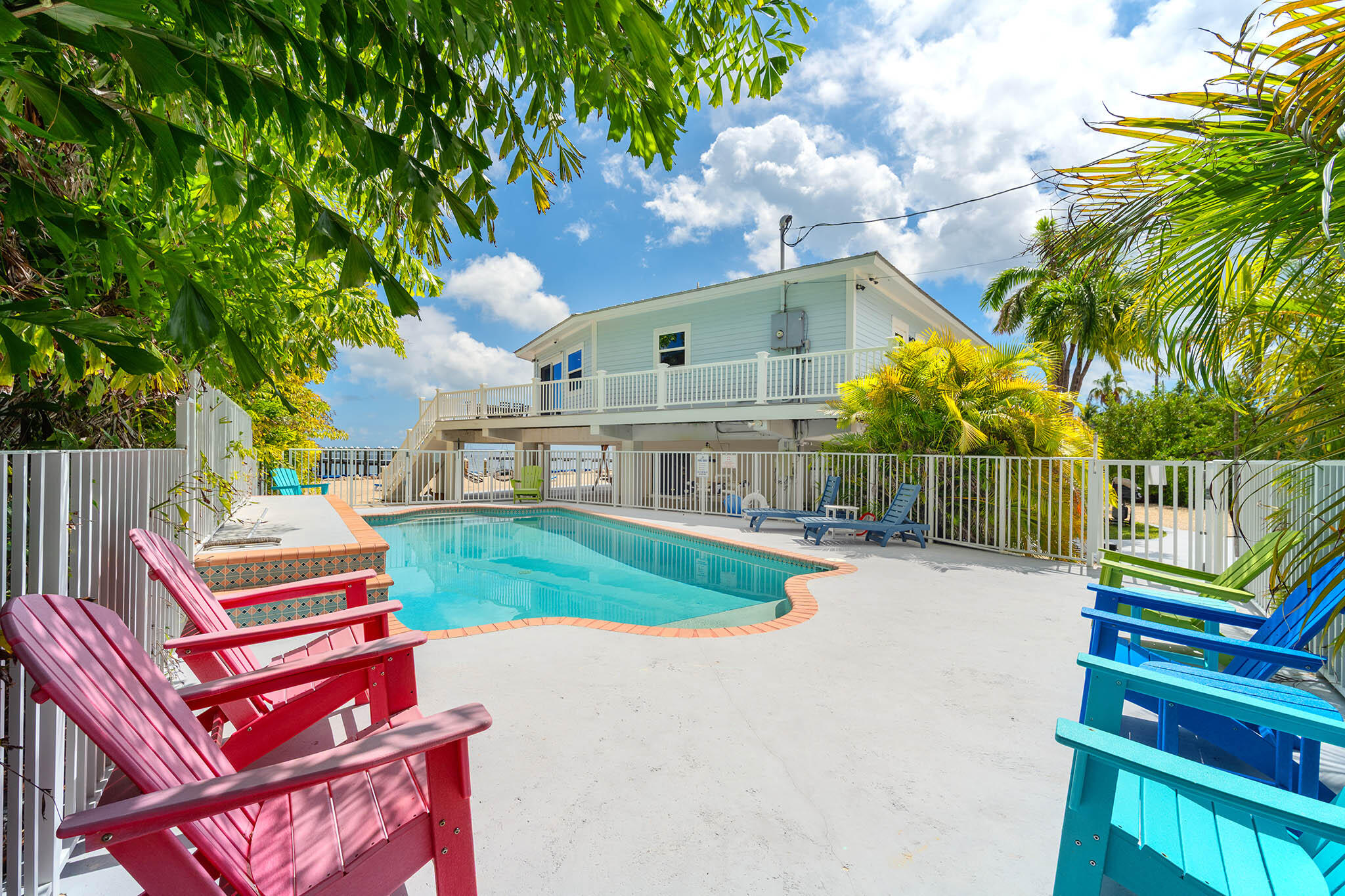 31473 Warner Street Big Pine Key, FL 33043 - Photo 34 of 49 a view of a backyard with couches under an umbrella