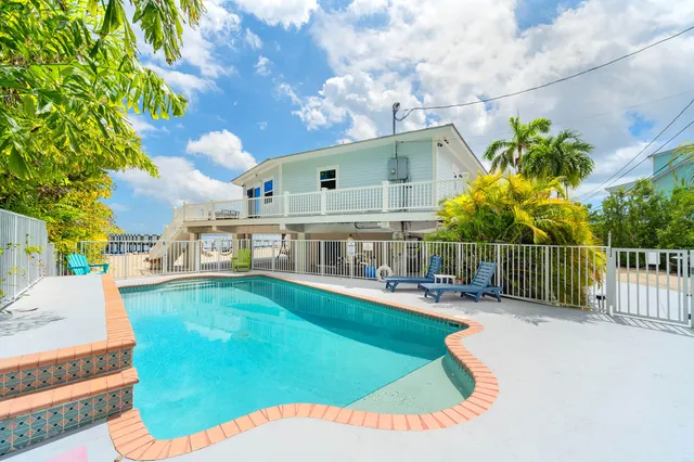 a view of swimming pool with outdoor seating