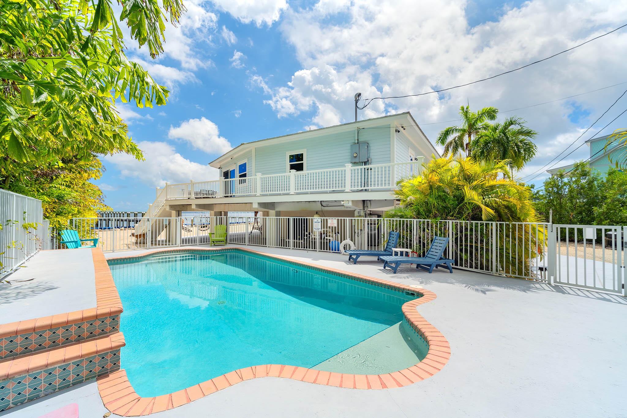 31473 Warner Street Big Pine Key, FL 33043 - Photo 35 of 49 a view of a house with a swimming pool