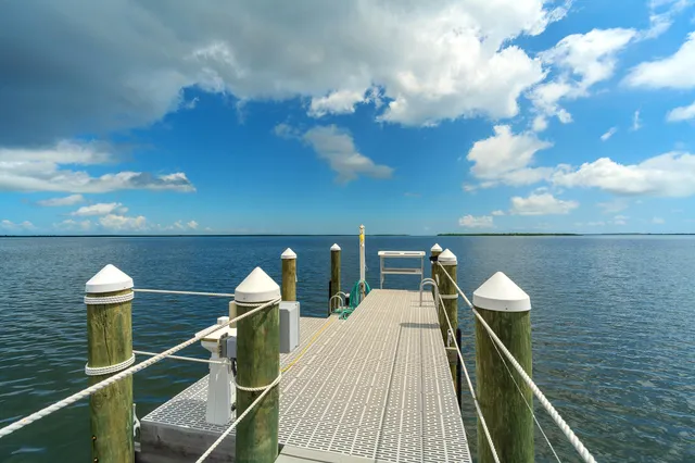 a view of a patio with a table and chairs