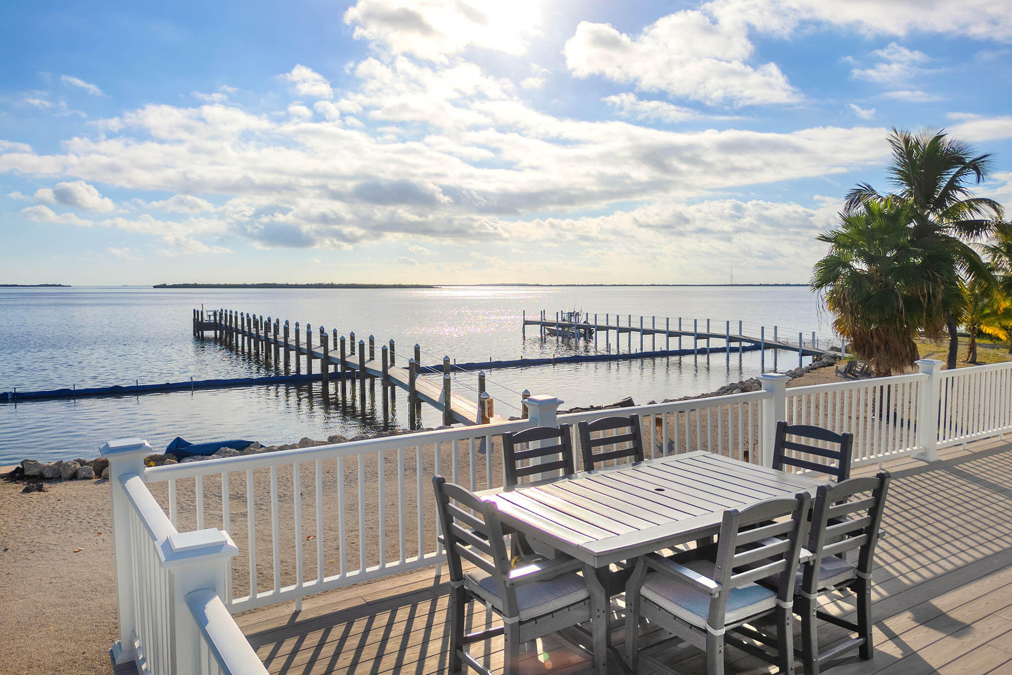 31473 Warner Street Big Pine Key, FL 33043 - Photo 4 of 49 a view of balcony with wooden floor and seating