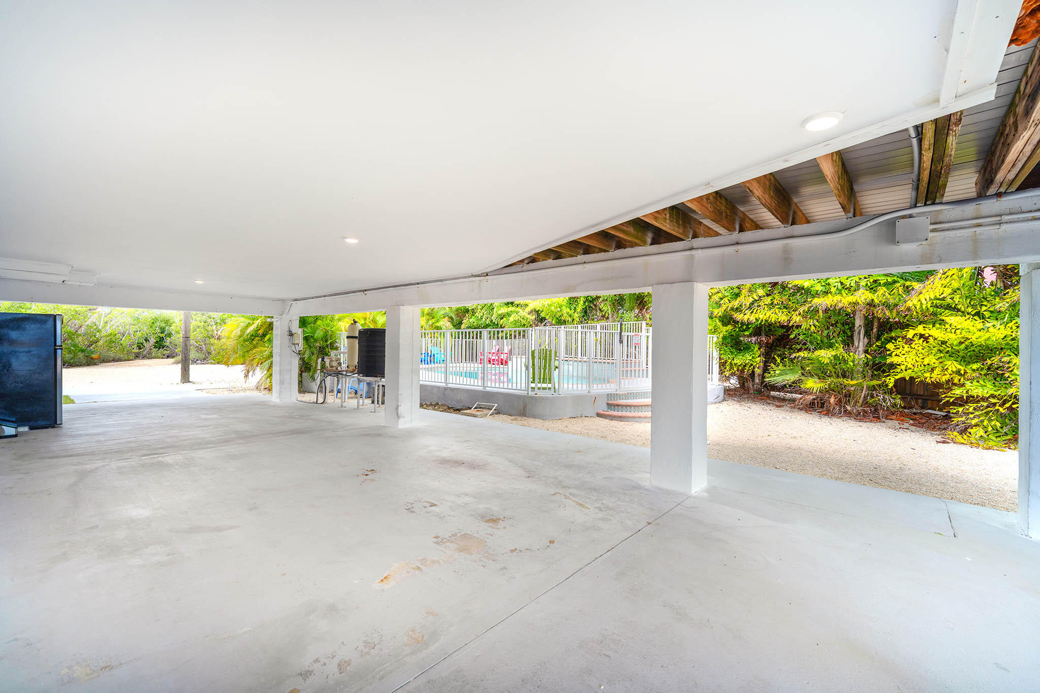 31473 Warner Street Big Pine Key, FL 33043 - Photo 44 of 49 a view of a patio with a table and chairs in front of it