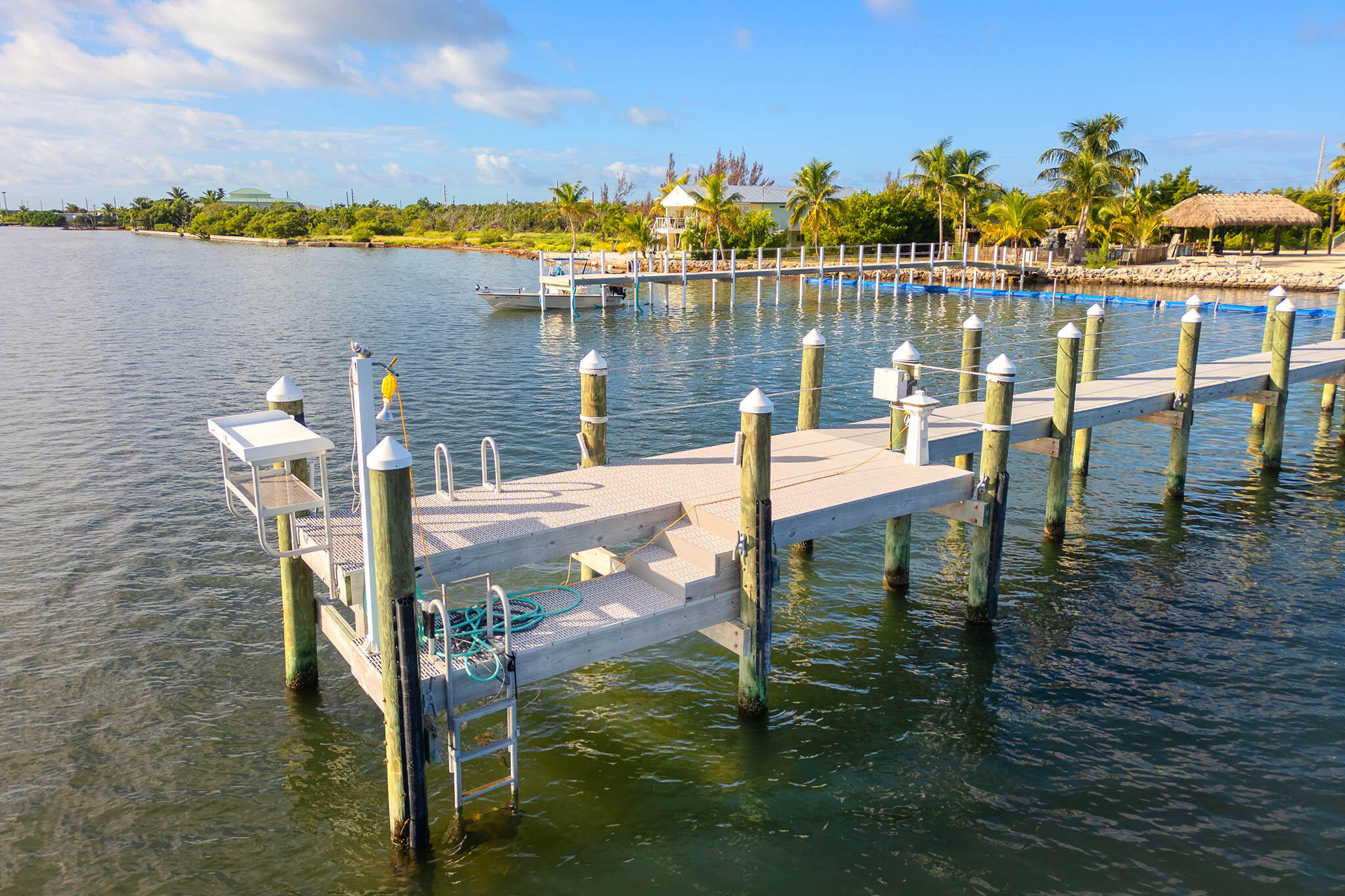 31473 Warner Street Big Pine Key, FL 33043 - Photo 5 of 49 a view of a lake from a balcony with chairs