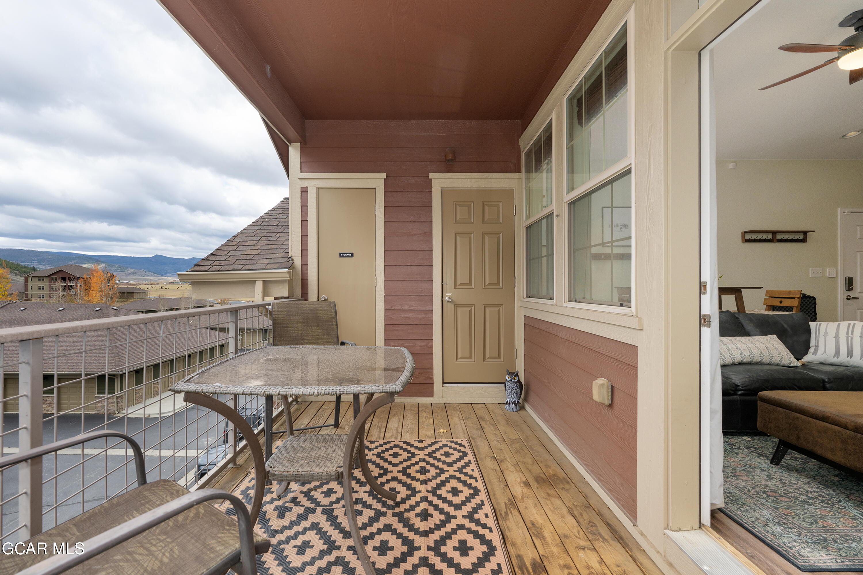 150 Village Road, Unit A307 Granby, CO 80446 - Photo 11 of 34 a balcony with furniture and a rug