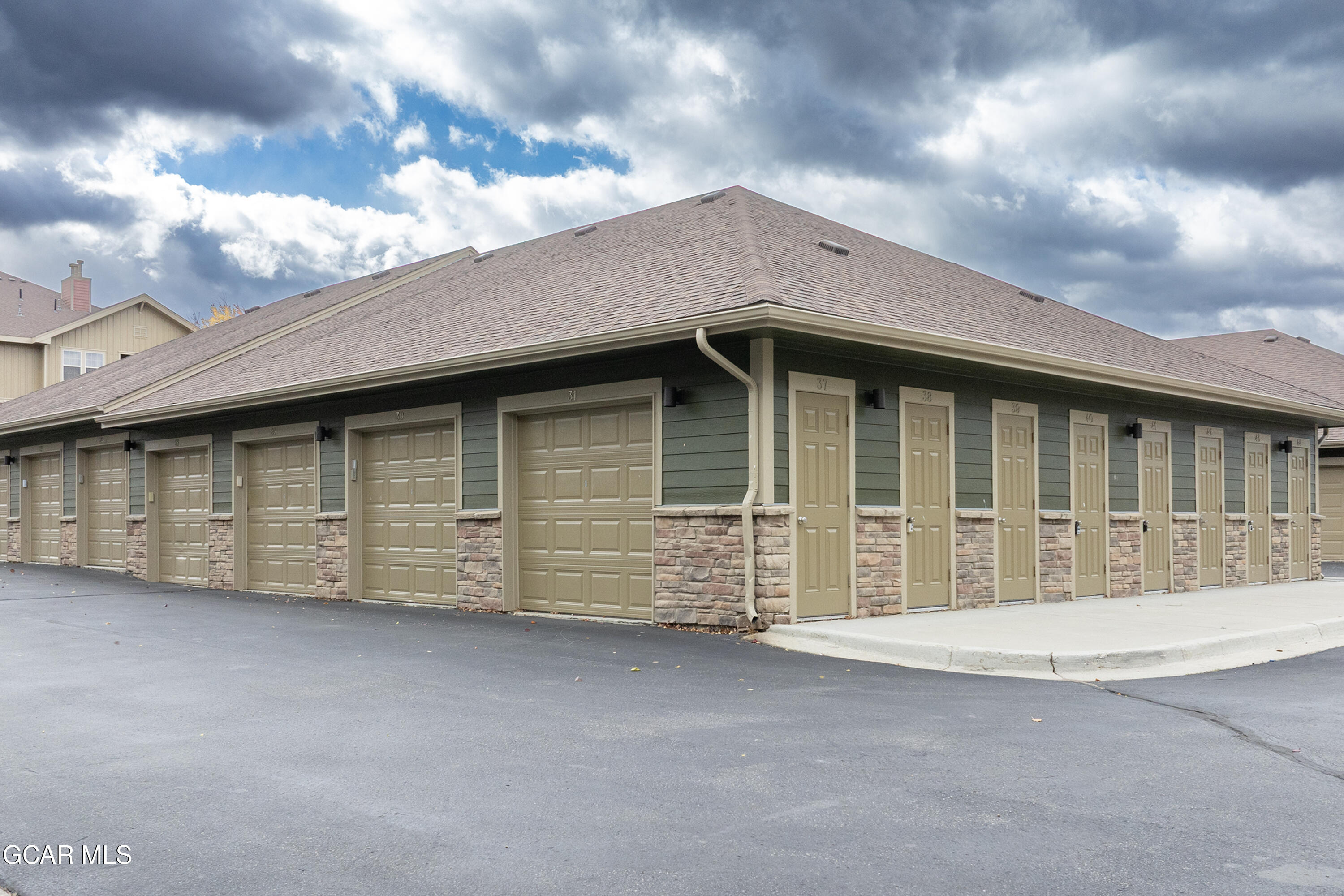 150 Village Road, Unit A307 Granby, CO 80446 - Photo 23 of 34 a view of a house with a garage