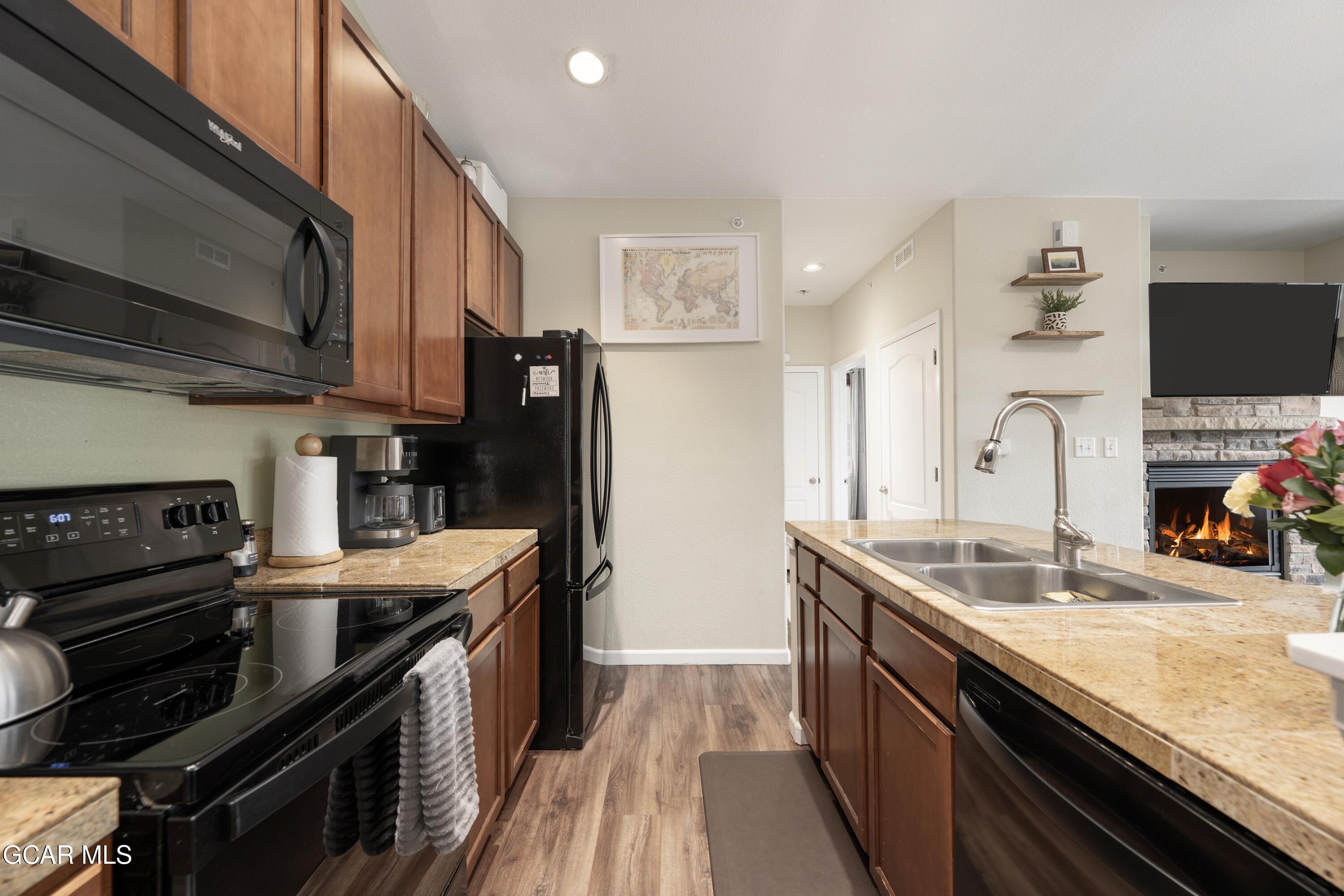 150 Village Road, Unit A307 Granby, CO 80446 - Photo 6 of 34 a kitchen with stainless steel appliances granite countertop a sink stove and refrigerator
