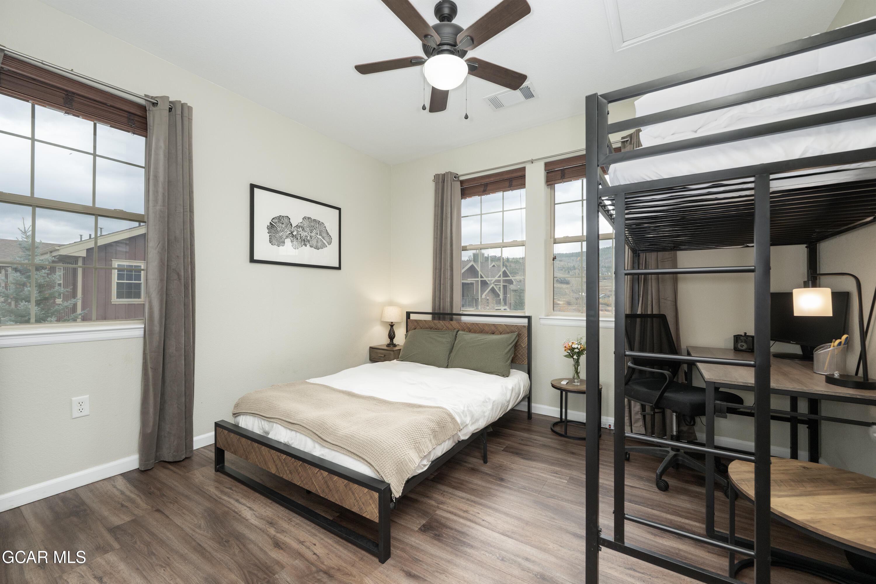 150 Village Road, Unit A307 Granby, CO 80446 - Photo 8 of 34 a bedroom with a bed and a window