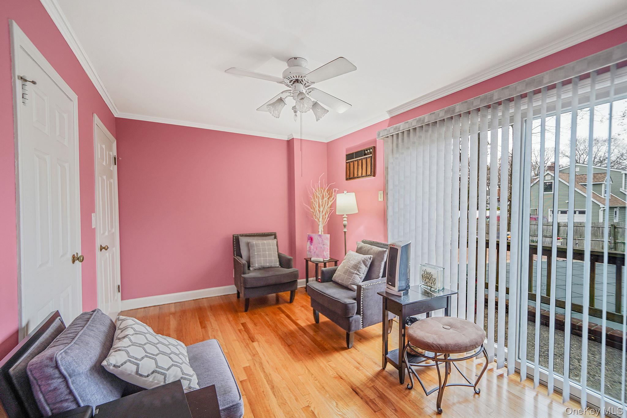 7 Rugby Road Westbury, NY 11590 - Photo 21 of 46 Sitting room featuring ornamental molding, a ceiling fan, and light wood-style flooring