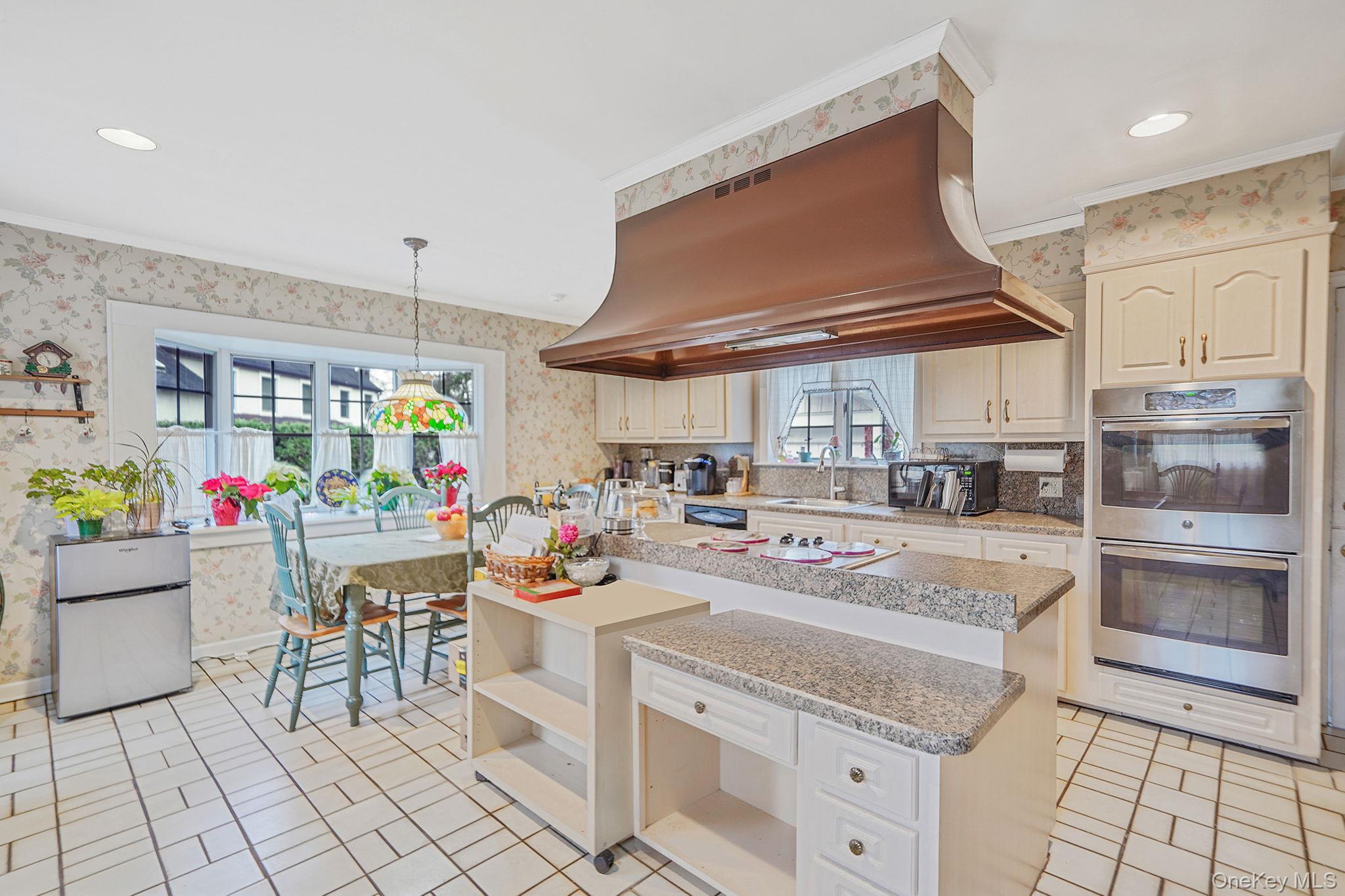 7 Rugby Road Westbury, NY 11590 - Photo 9 of 46 Kitchen featuring wallpapered walls, appliances with stainless steel finishes, open shelves, recessed lighting, and light tile patterned flooring