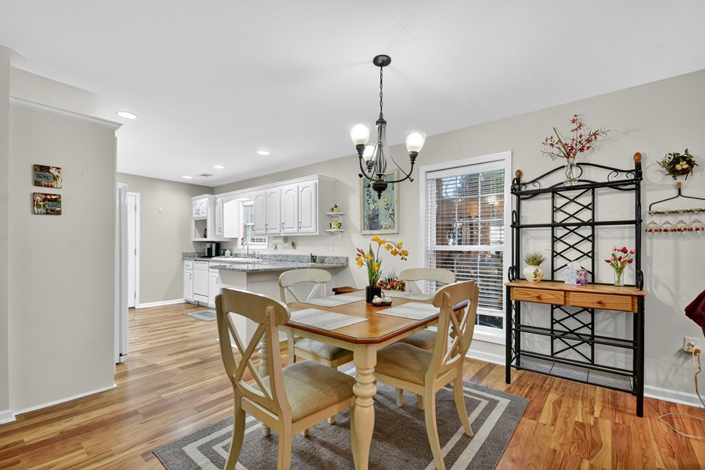 66 Westward Lane Blue Ridge, GA 30513 - Photo 11 of 34 a view of a dining room with furniture wooden floor and chandelier