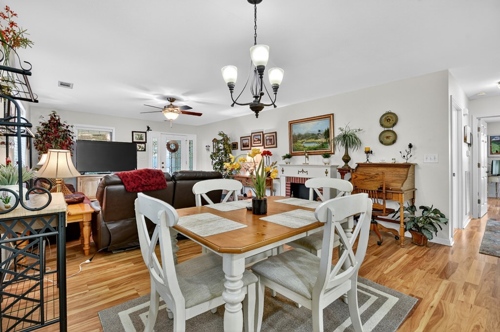 66 Westward Lane Blue Ridge, GA 30513 - Photo 12 of 34 a view of a dining room with furniture wooden floor and chandelier