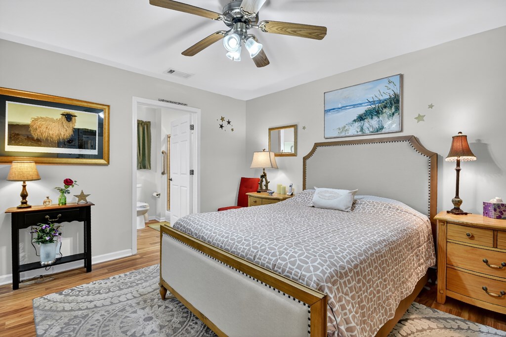 66 Westward Lane Blue Ridge, GA 30513 - Photo 25 of 34 a bedroom with a bed and a chandelier